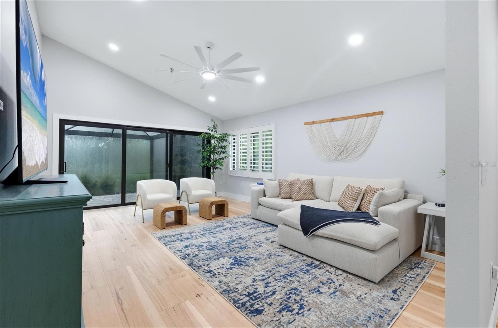 Living room to large screened lanai with new stone pavers - 2141 HARBOURSIDE DR #1203, LONGBOAT KEY