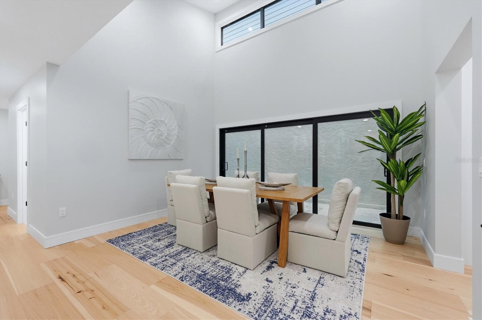Dining room adjacent to atrium - 2141 HARBOURSIDE DR #1203, LONGBOAT KEY