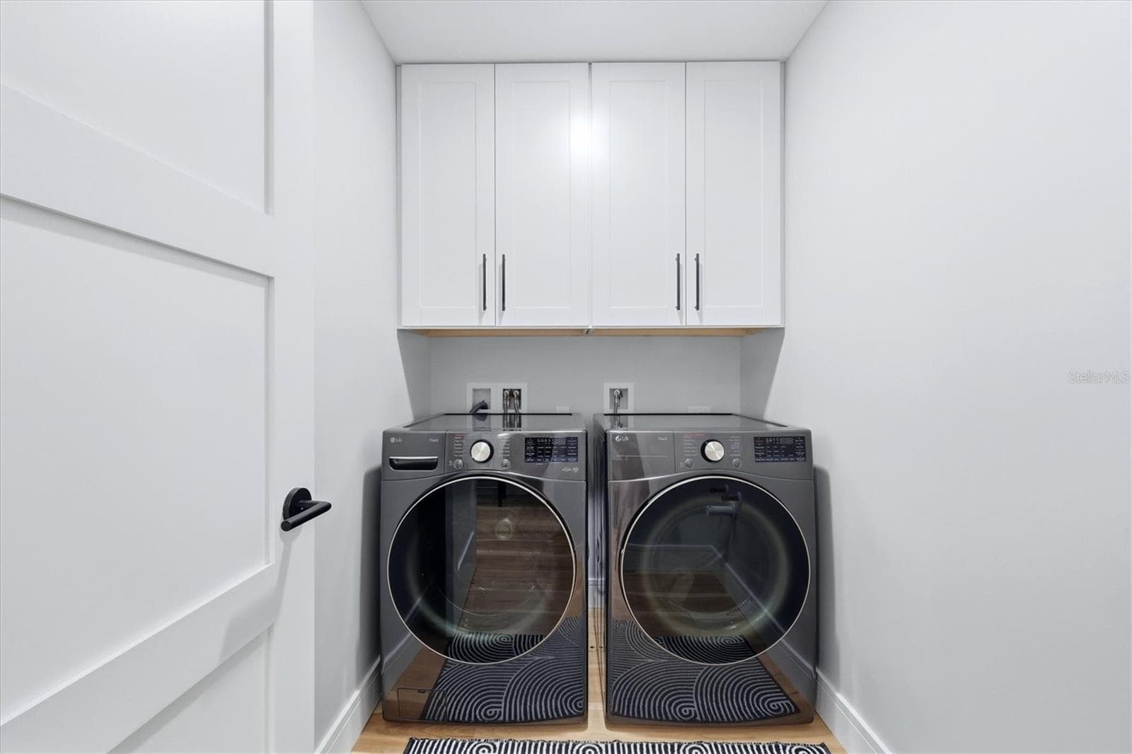 Laundry Room with storage cabinets - 2141 HARBOURSIDE DR #1203, LONGBOAT KEY