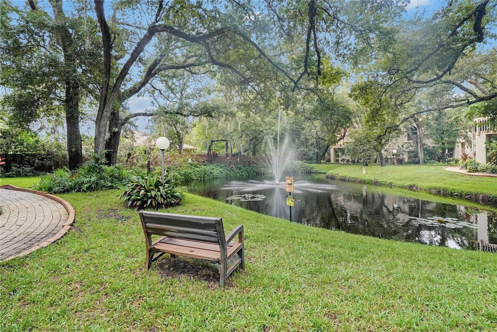 One of many ponds in the community - 203 LOS PRADOS DR #1322, SAFETY HARBOR