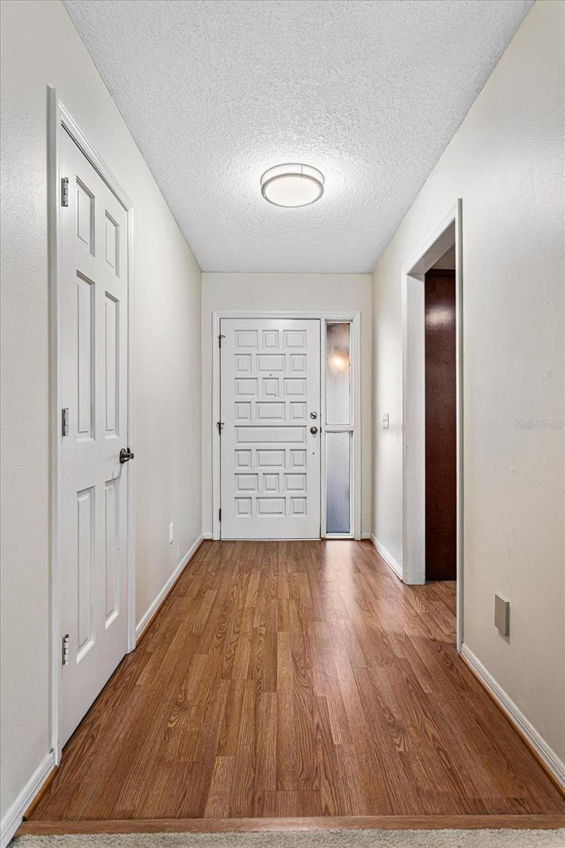 Foyer with coat closet, opens to kitchen and great room - 179 GOLF CLUB DR, LONGWOOD