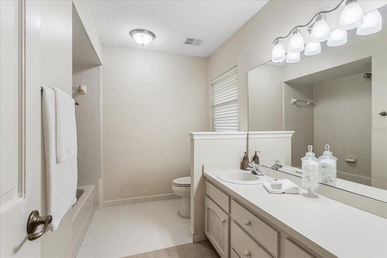 Bathroom 2, large vanity and tub with shower - 179 GOLF CLUB DR, LONGWOOD