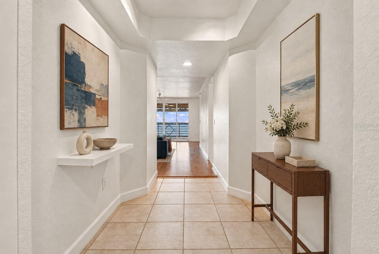 Front hallway entry virtually staged - 4993 BACOPA LN S #304, ST PETERSBURG