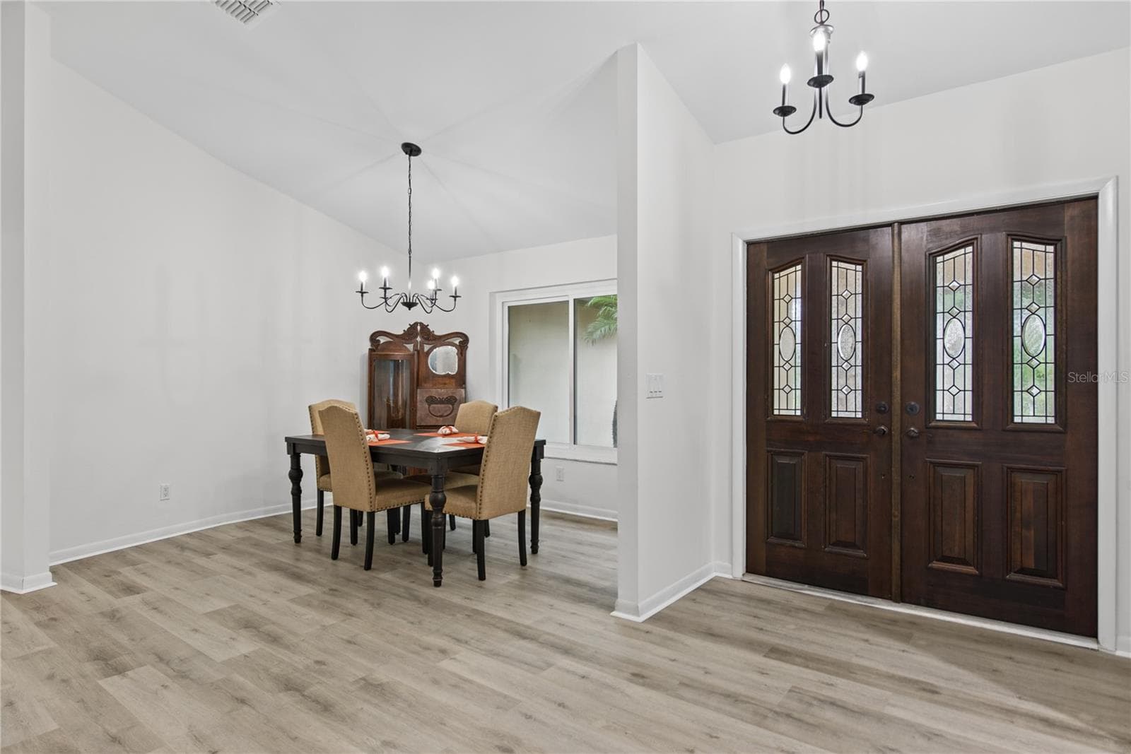 FRONT ENTRANCE DOUBLE DOORS & FORMAL DINING ROOM - 2194 PINNACLE CIR N, PALM HARBOR