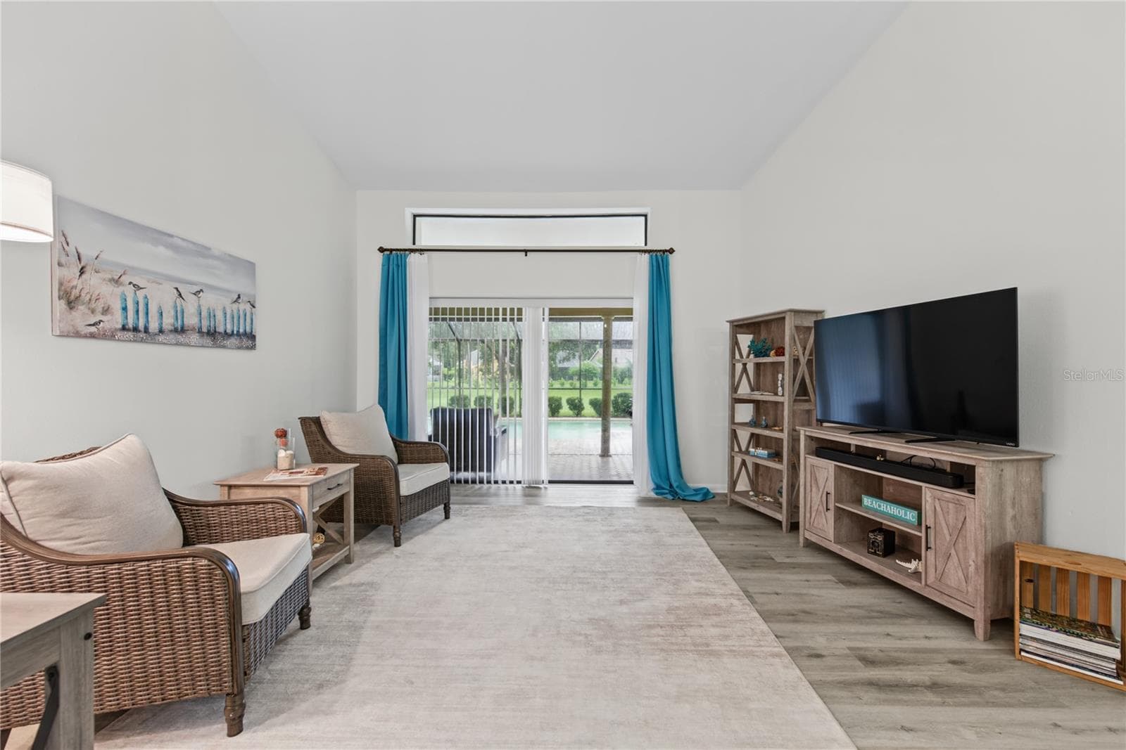 LIVING ROOM VIEWS SLIDER TO POOL CURTAINS DO NOT CONVEY - 2194 PINNACLE CIR N, PALM HARBOR