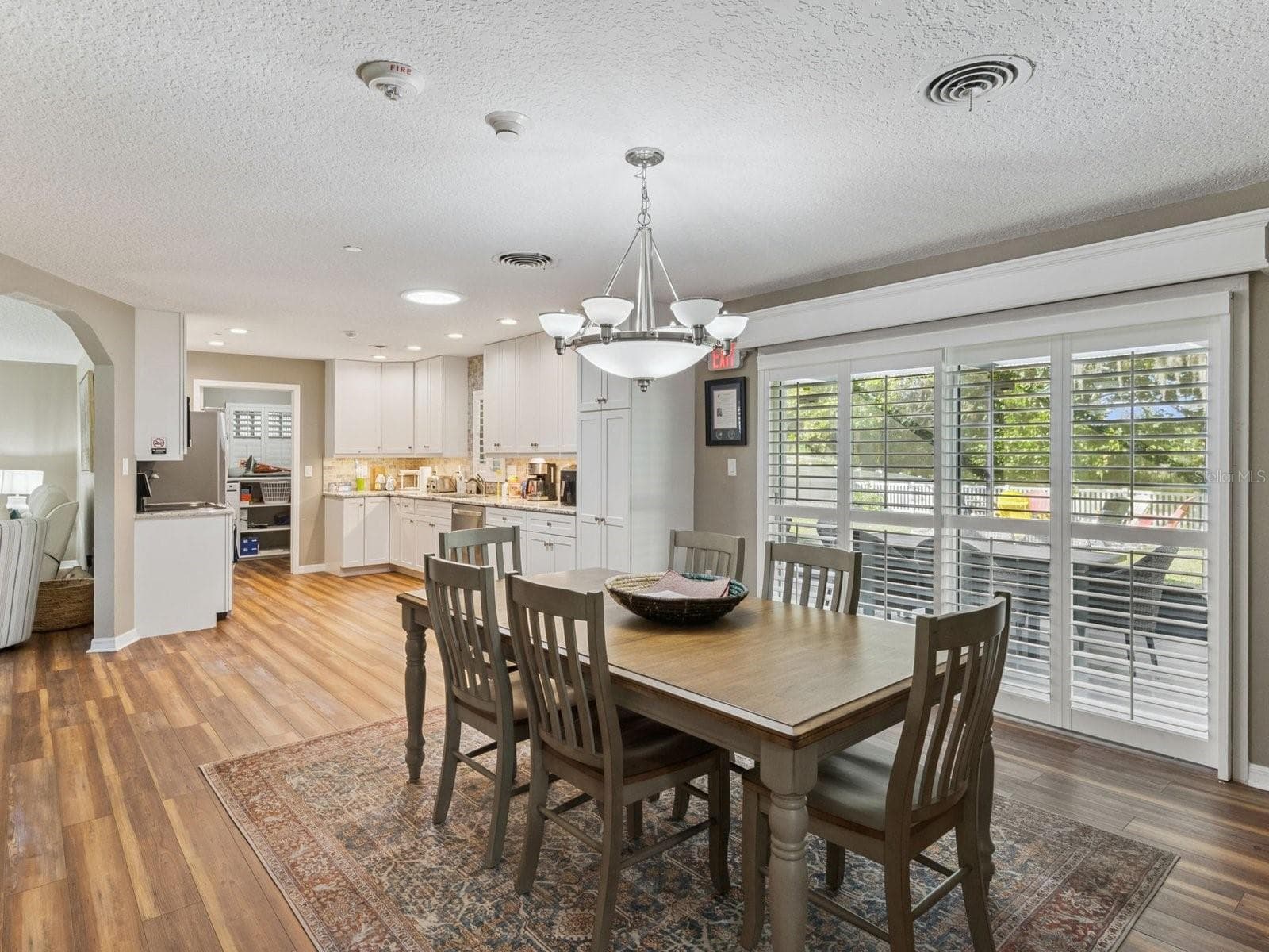 Dining room flows into kitchen and laundry - SPRING LAKE MANOR, FRUITLAND PARK