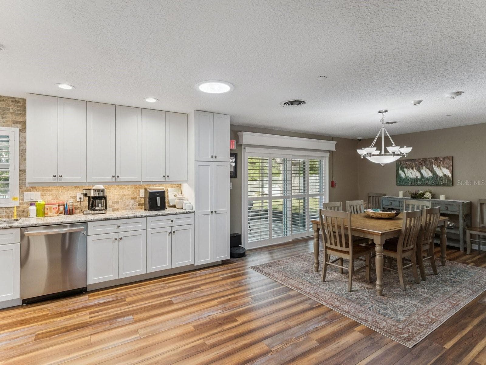 White shaker cabinets and pantry storage - SPRING LAKE MANOR, FRUITLAND PARK