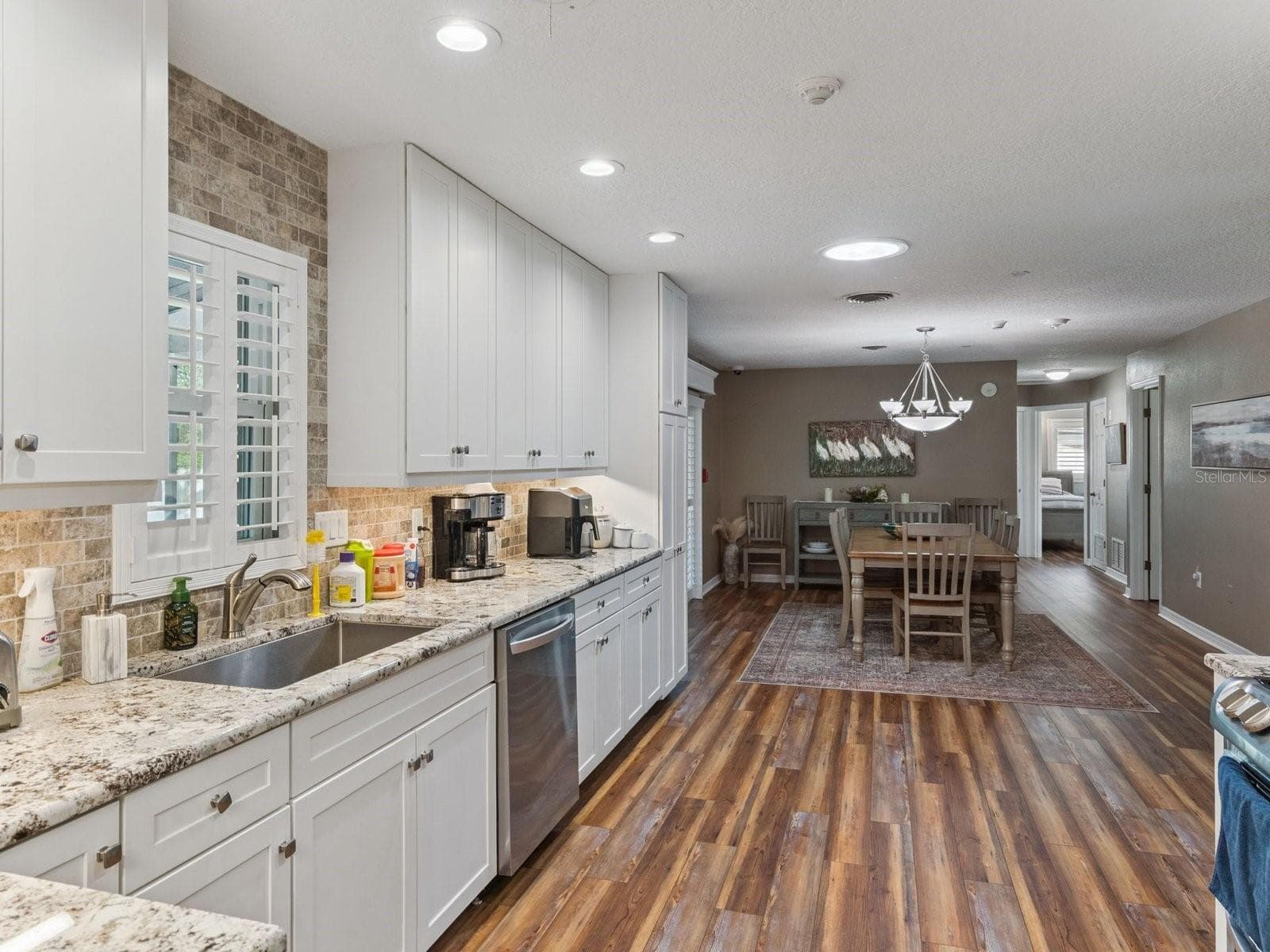 Remodeled kitchen open to dining - SPRING LAKE MANOR, FRUITLAND PARK