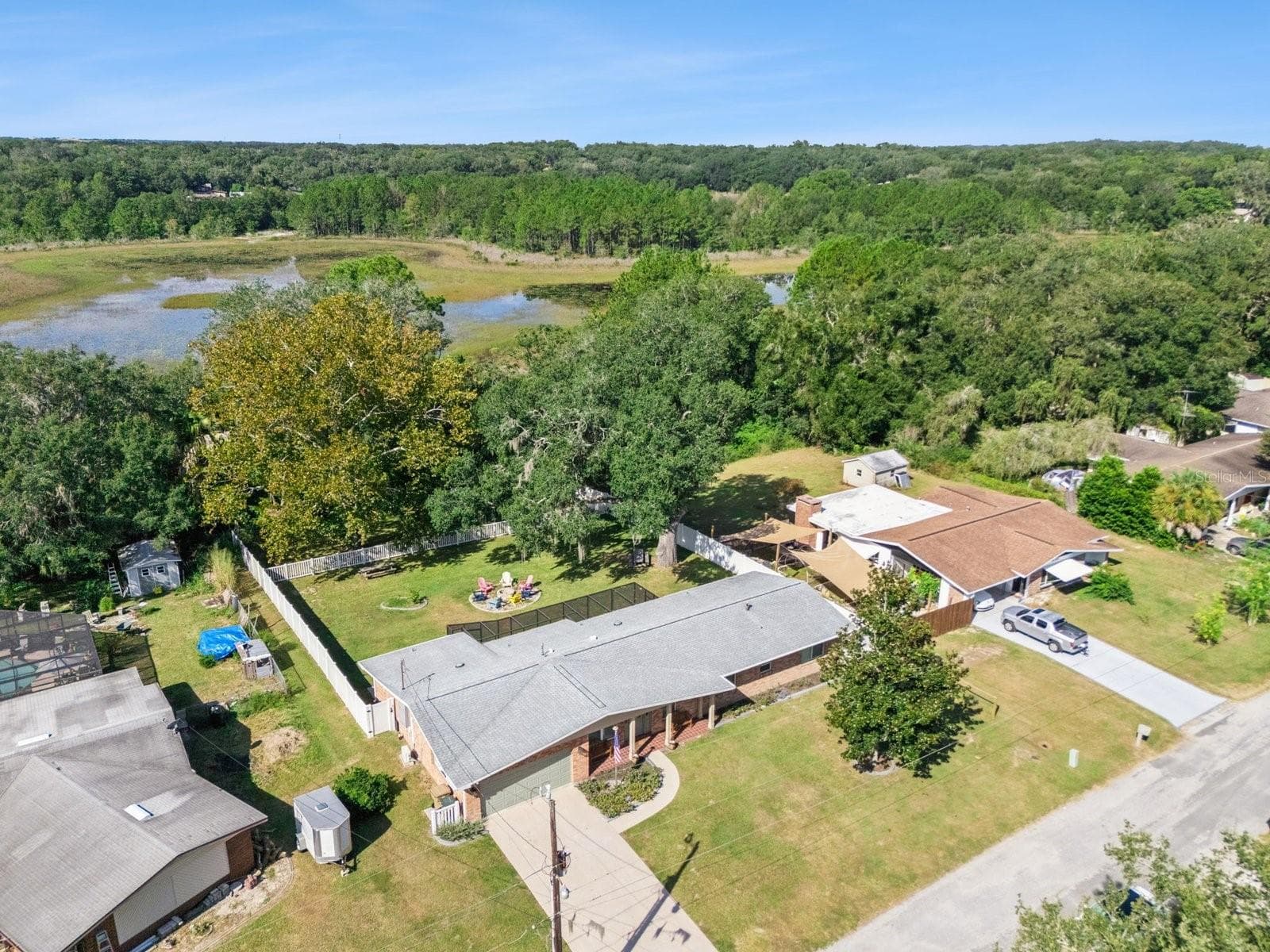 Aerial of backyard toward Spring Lake - SPRING LAKE MANOR, FRUITLAND PARK
