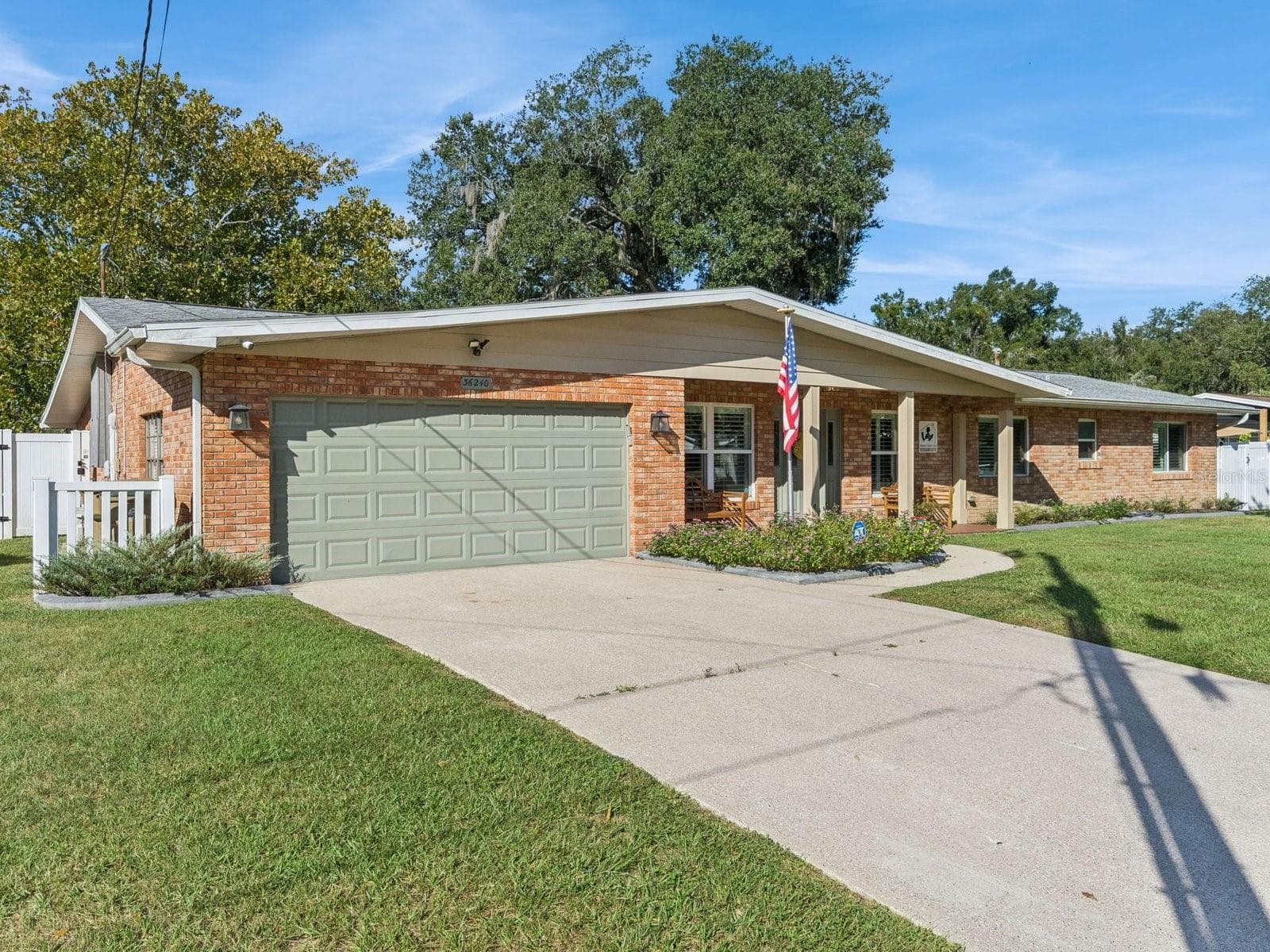 Attached 2-car garage and wide driveway - SPRING LAKE MANOR, FRUITLAND PARK