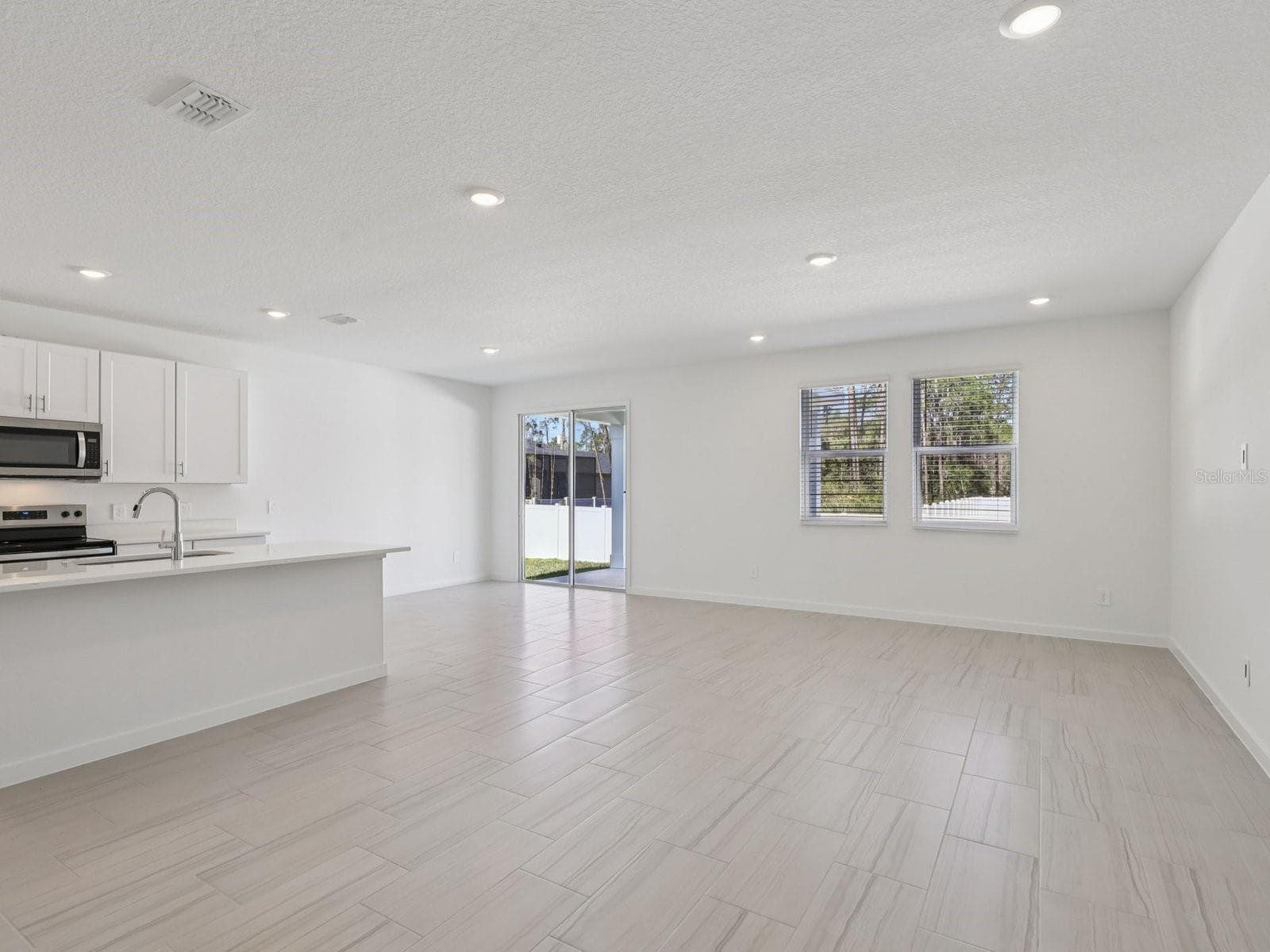 Photo is not of the actual home, but is an inspirational photo of builder’s model home and may depict options, furnishings, and/or decorator features that are not included. - 33 GARNI DR, PALM COAST