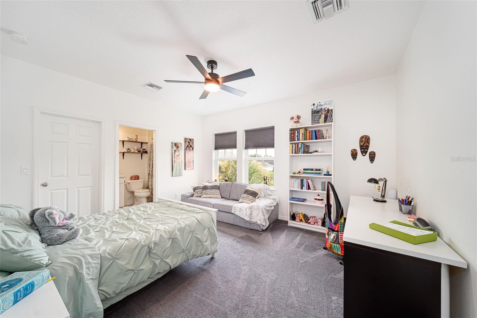 Spacious secondary bedroom with the convenience of a private en-suite bath. - 6195 ANISE DR, SARASOTA