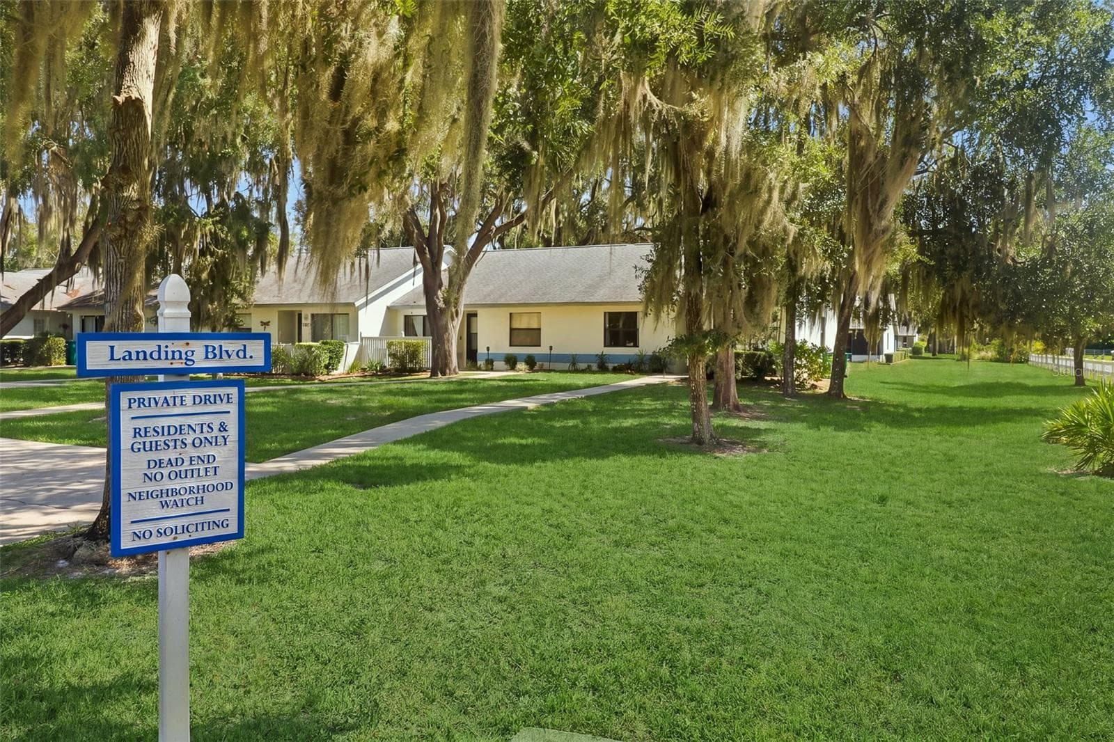 View of community signage and lot view when entering neighborhood - 480 LANDING BLVD, INVERNESS