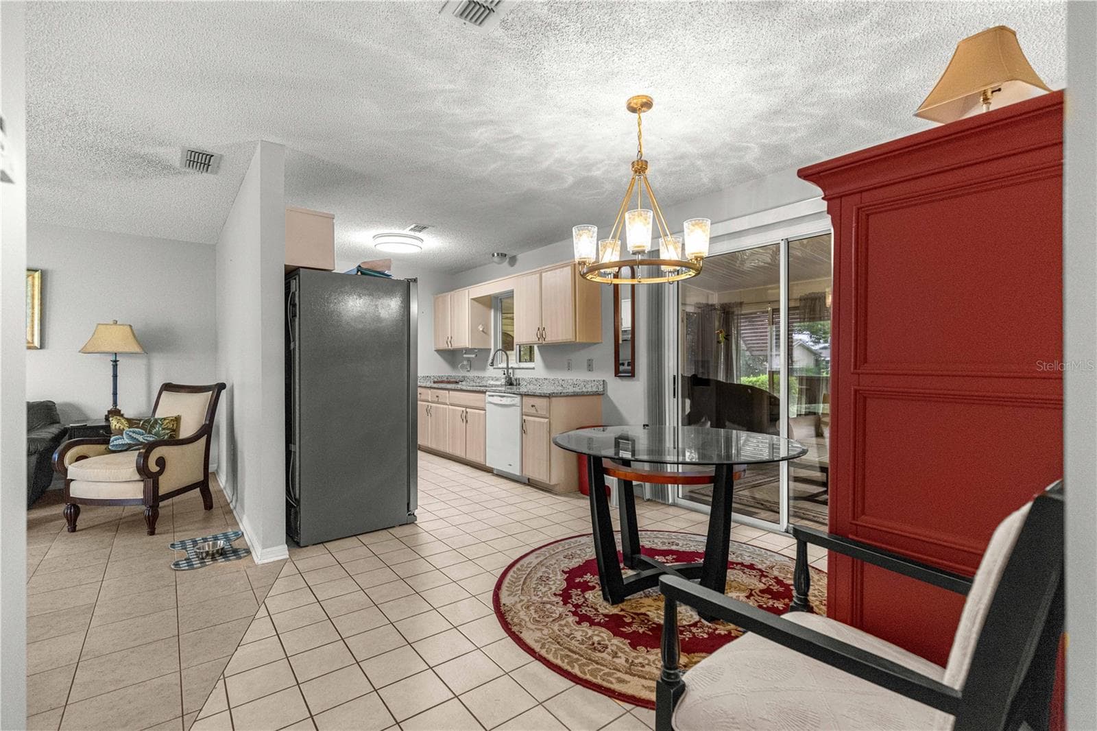 LIVING ROOM TO DINING , KITCHEN AND FLORIDA ROOM SLIDING DOORS - 10434 SE 178TH PL, SUMMERFIELD