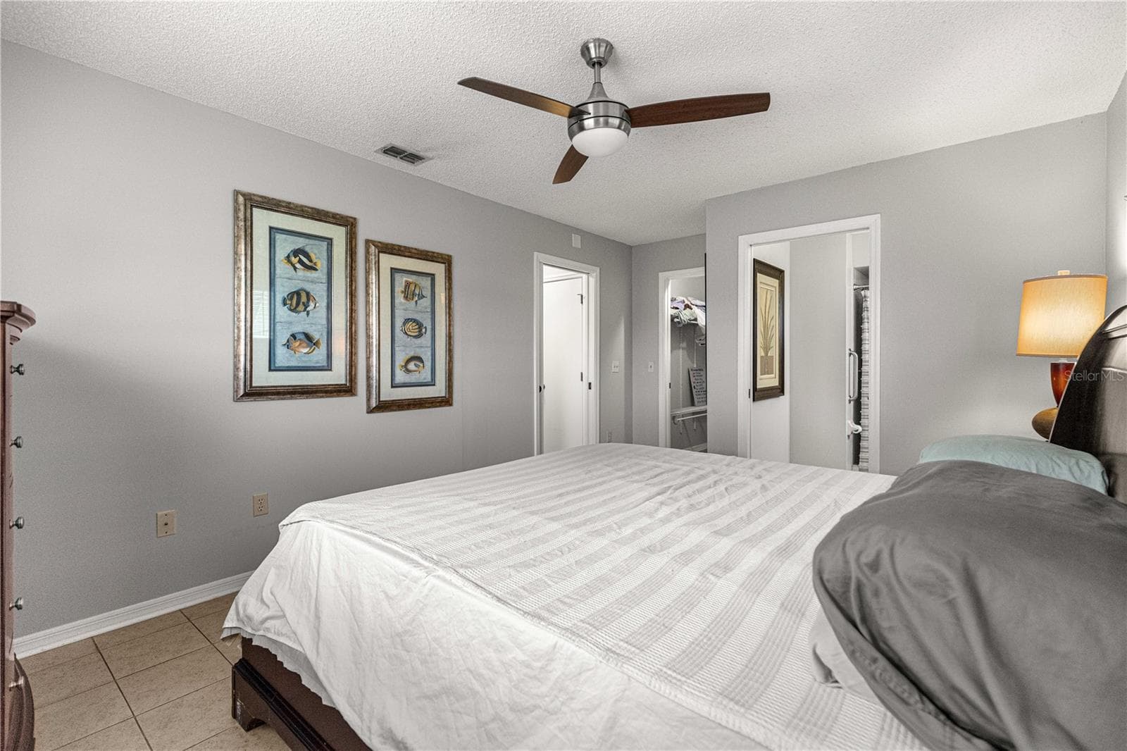 PRIMARY BEDROOM, WITH MODERN FAN AND TILED FLOORS - 10434 SE 178TH PL, SUMMERFIELD