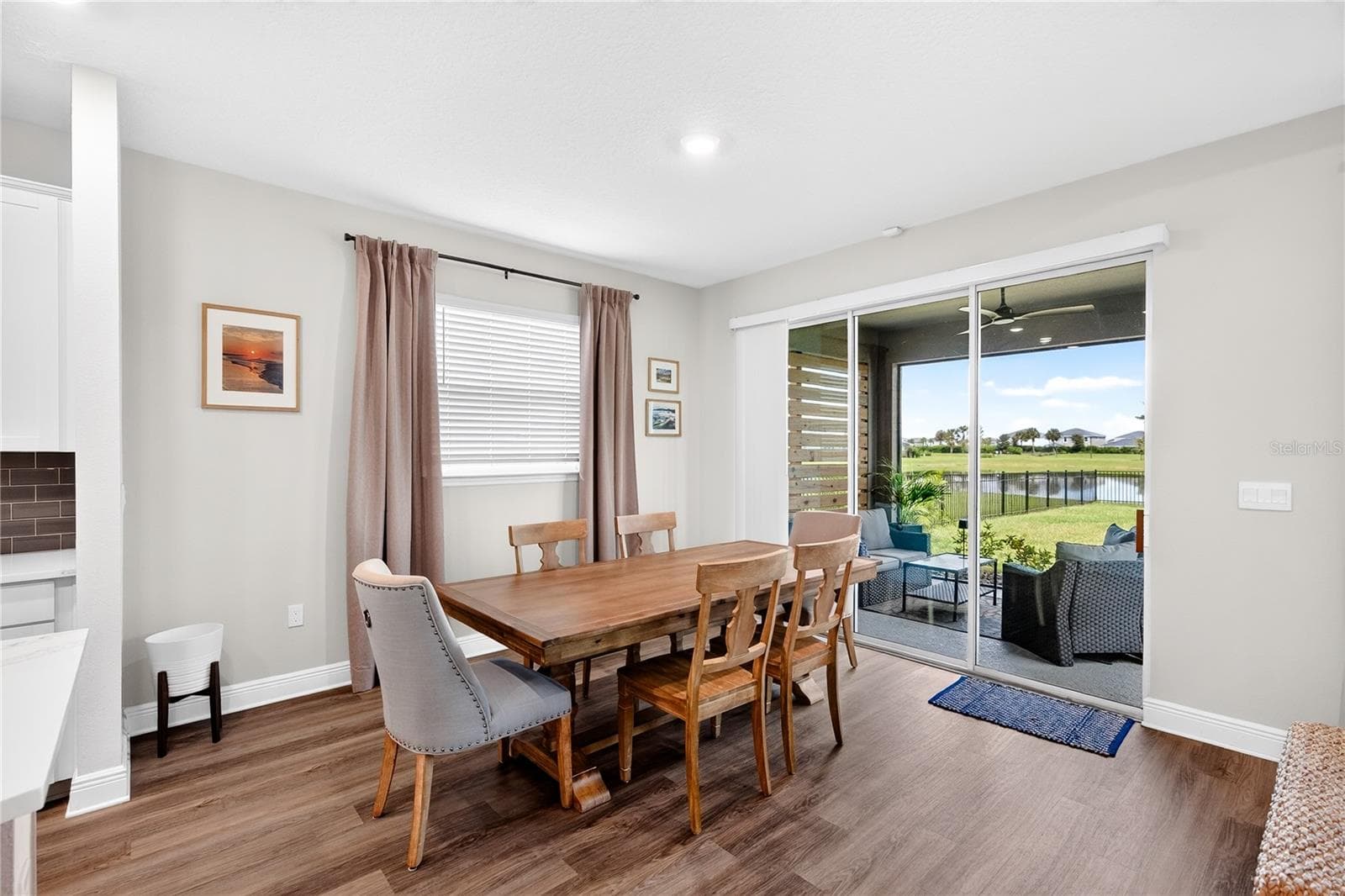 Dining area leading to lanai - 18009 TAVERNSIDE TRL, LAKEWOOD RANCH