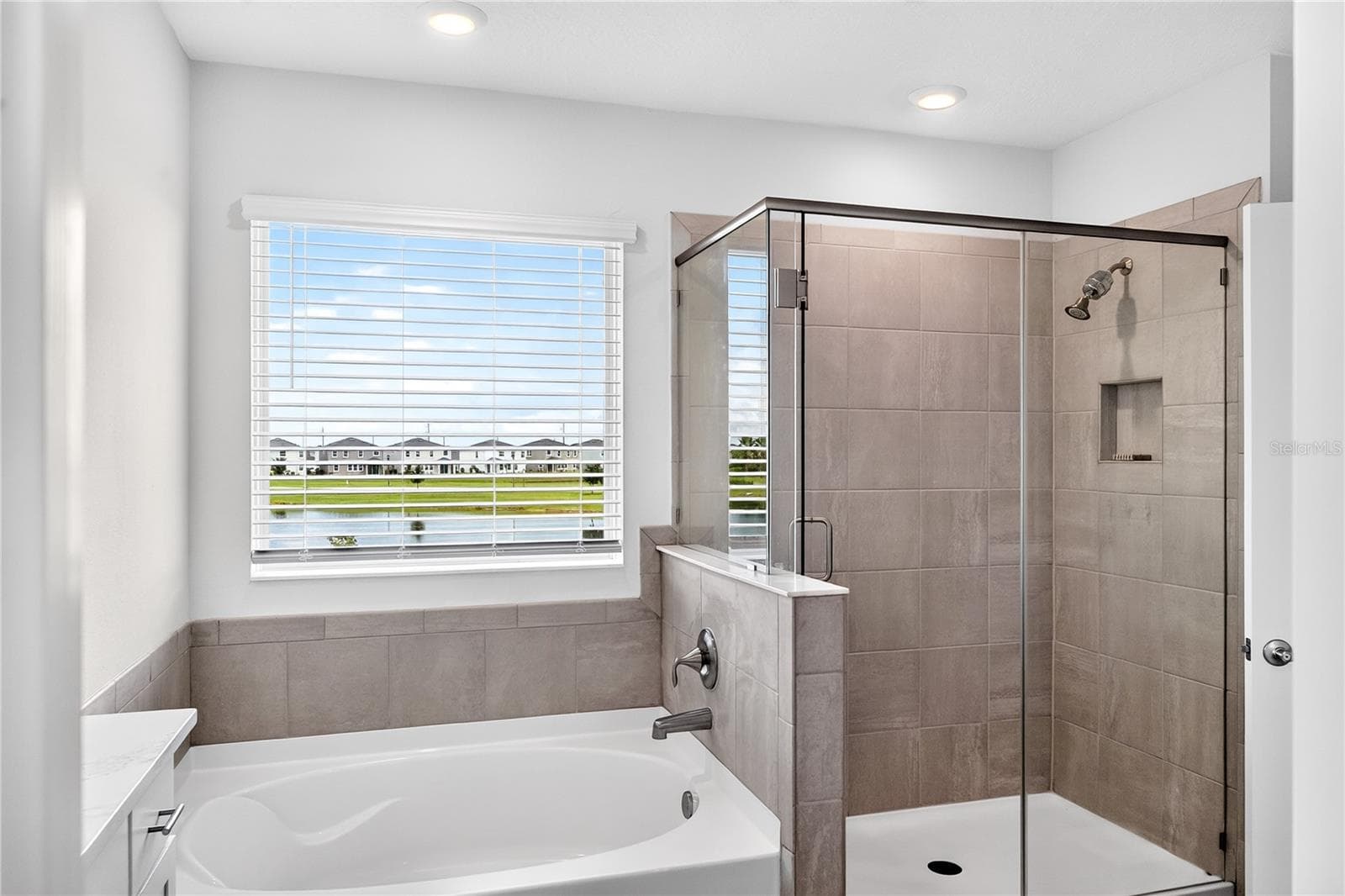 Primary bath with tub & shower - 18009 TAVERNSIDE TRL, LAKEWOOD RANCH