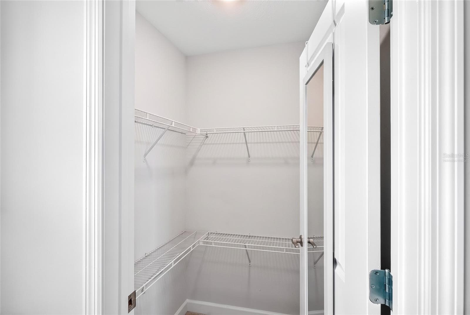 Upstairs 2nd bedroom closet virtually staged - 18009 TAVERNSIDE TRL, LAKEWOOD RANCH