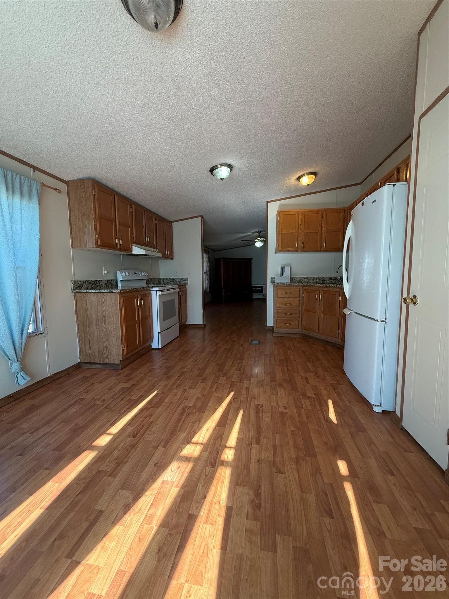 Large kitchen from dining area - 97 Fair Haven Drive, Burnsville