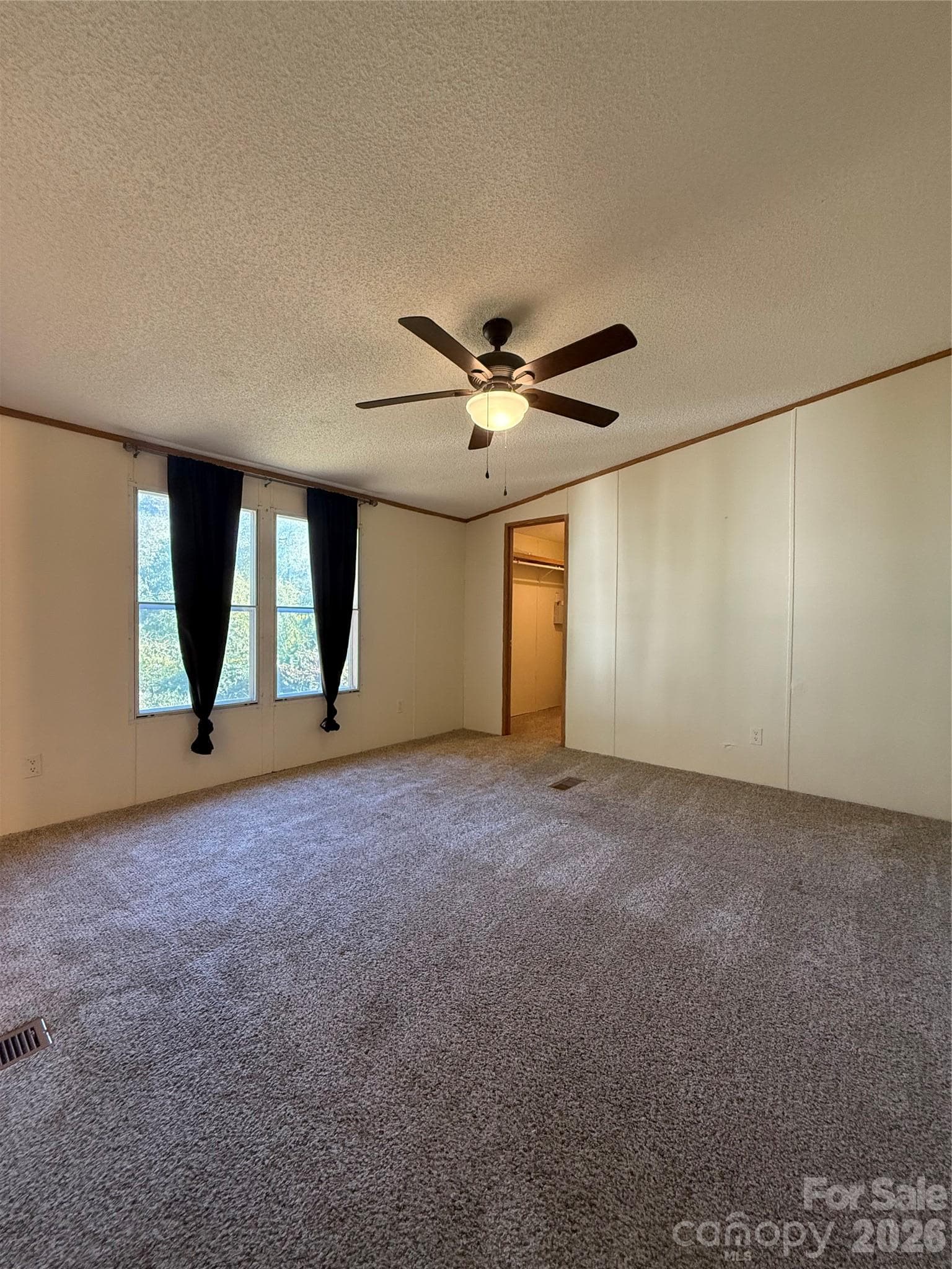 Primary bedroom with vaulted ceilings, large walk in closet and ensuite bath - 97 Fair Haven Drive, Burnsville