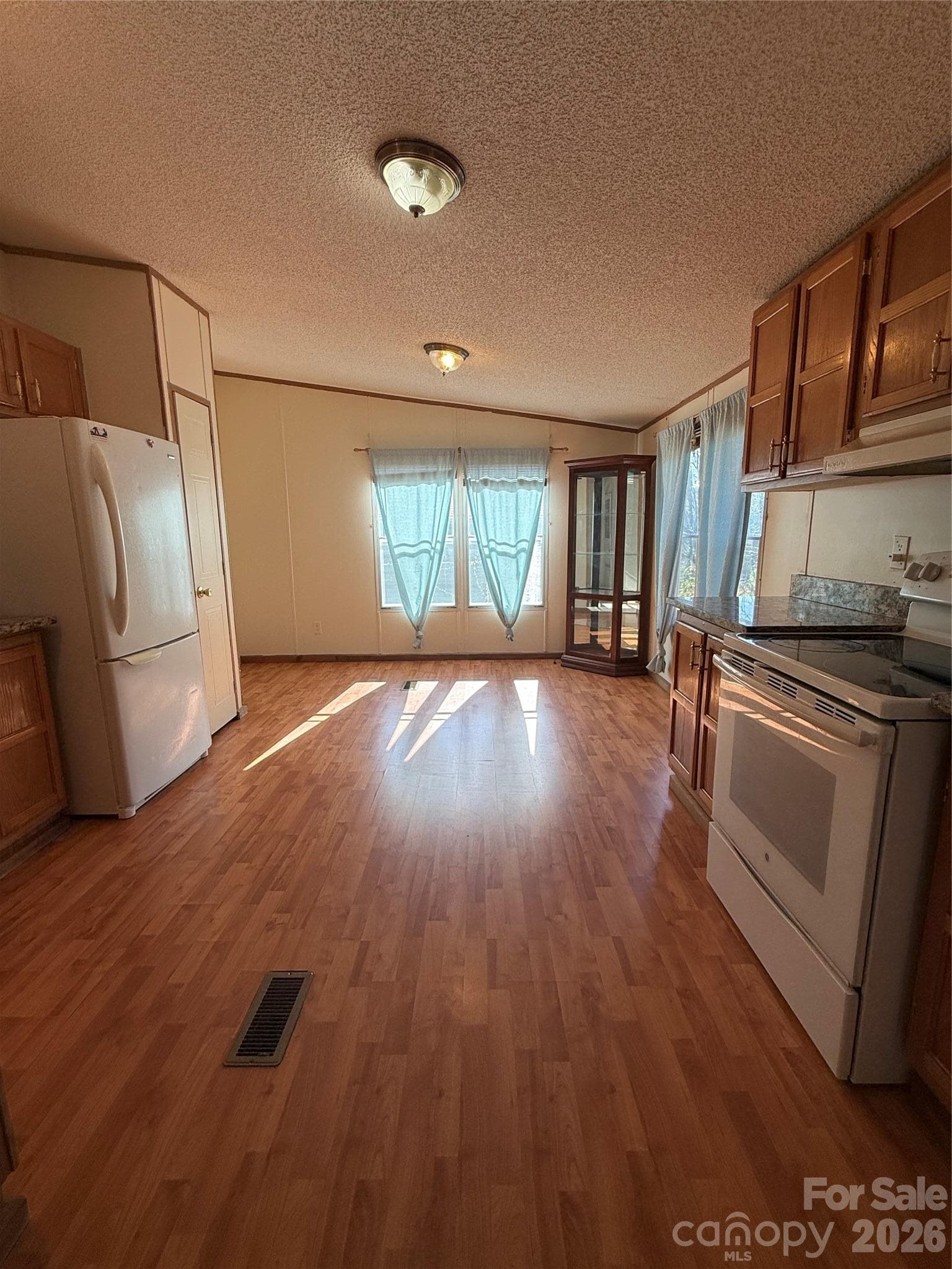 Dining area surrounded by windows - 97 Fair Haven Drive, Burnsville