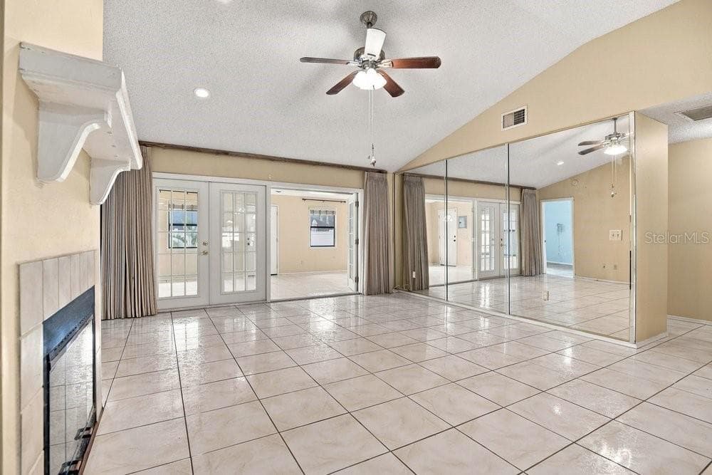 Living room overlooking enclosed Florida Room - 3600 BISCAYNE DR, WINTER SPRINGS