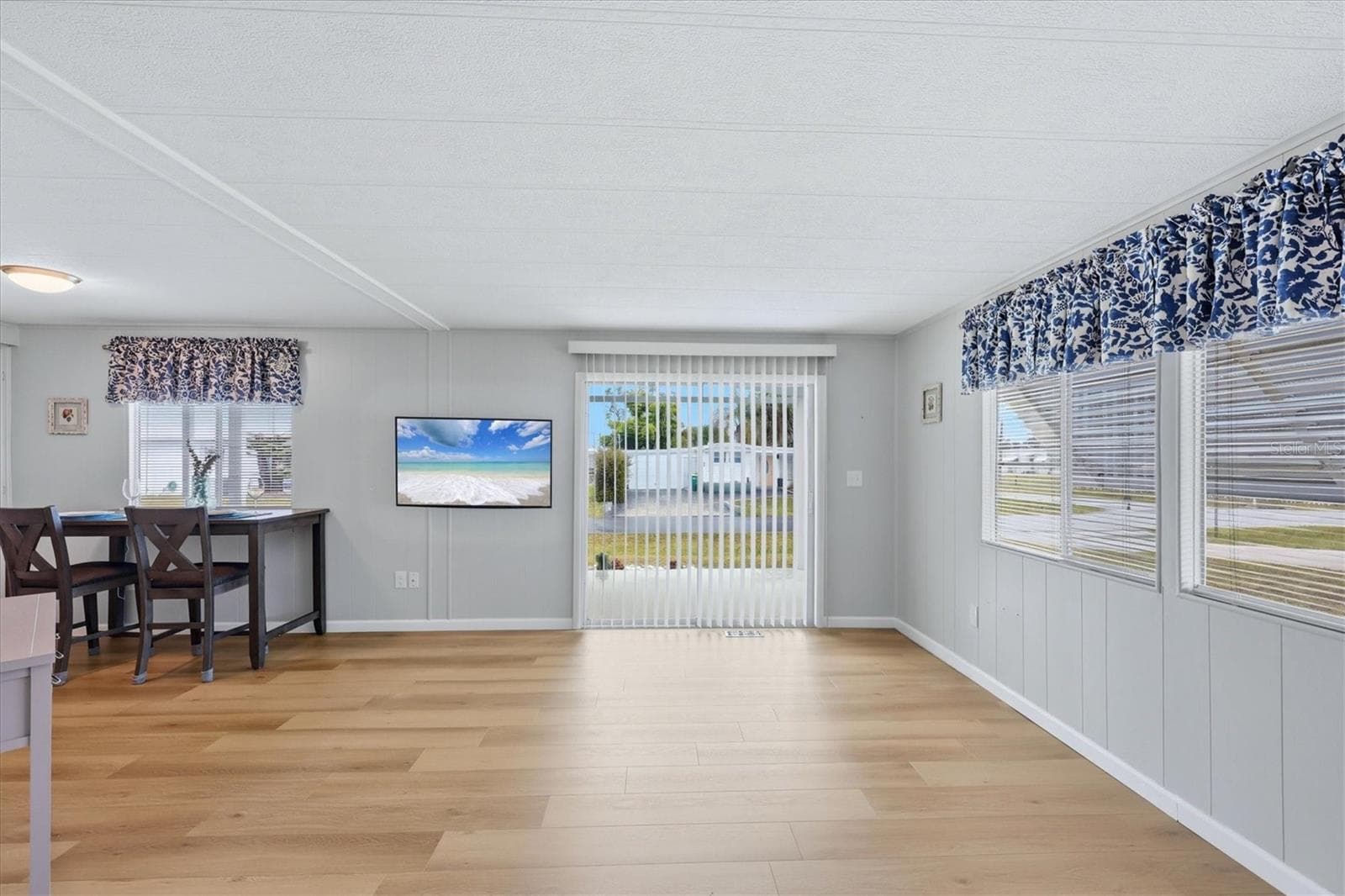 Living room with sliders leading to front porch - 240 VIA DE LUNA, ENGLEWOOD