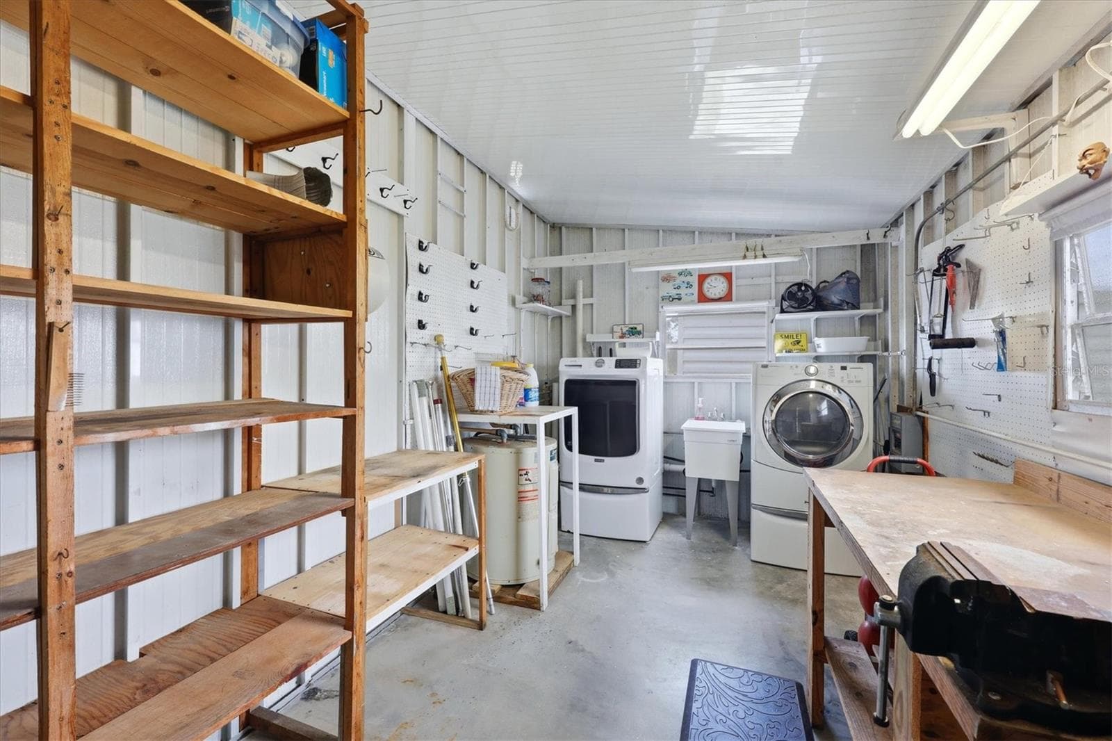 Enclosed Laundry room with workbench and storage - 240 VIA DE LUNA, ENGLEWOOD