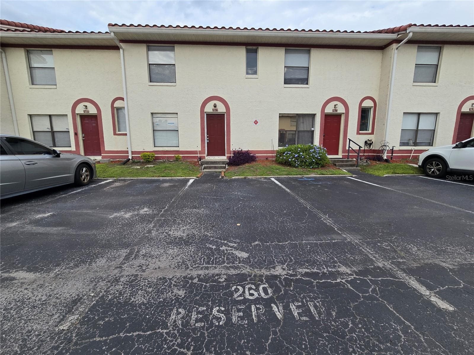 Front door & assigned parking - 1611 SHADY RIDGE CT #260, ORLANDO