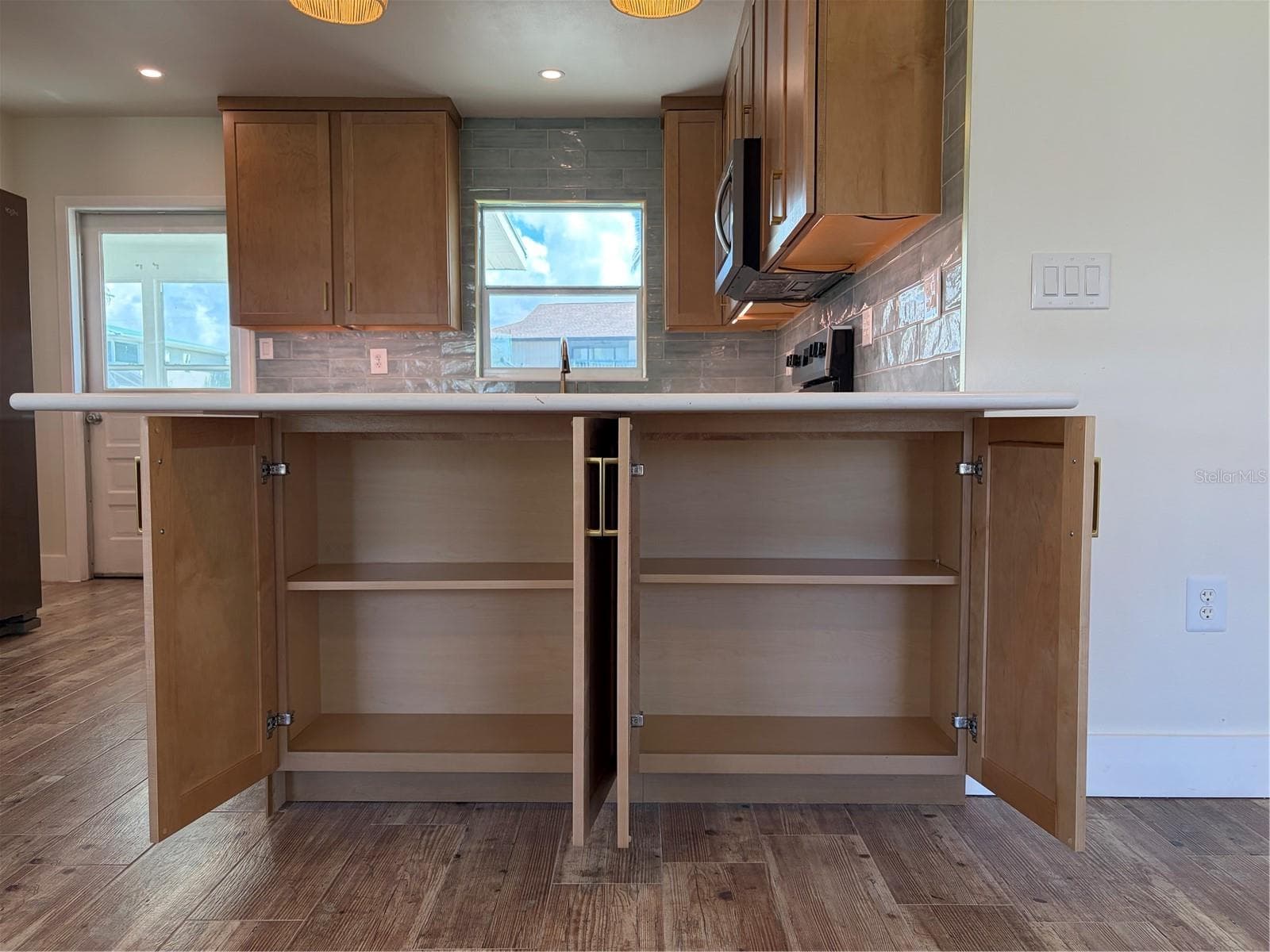 Updated kitchen peninsula with cabinet storage - 10451 MARION ST, ENGLEWOOD