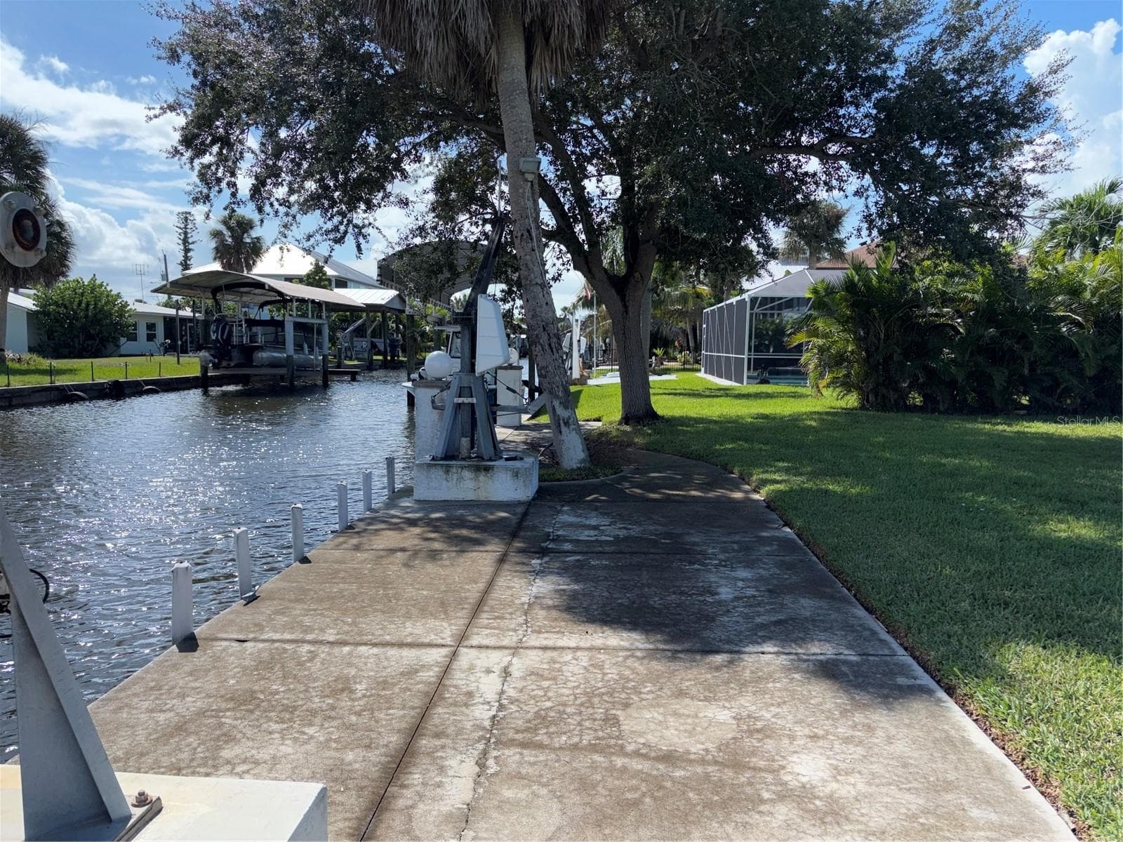 Saltwater canal in the back yard with extra concrete deck - 10451 MARION ST, ENGLEWOOD
