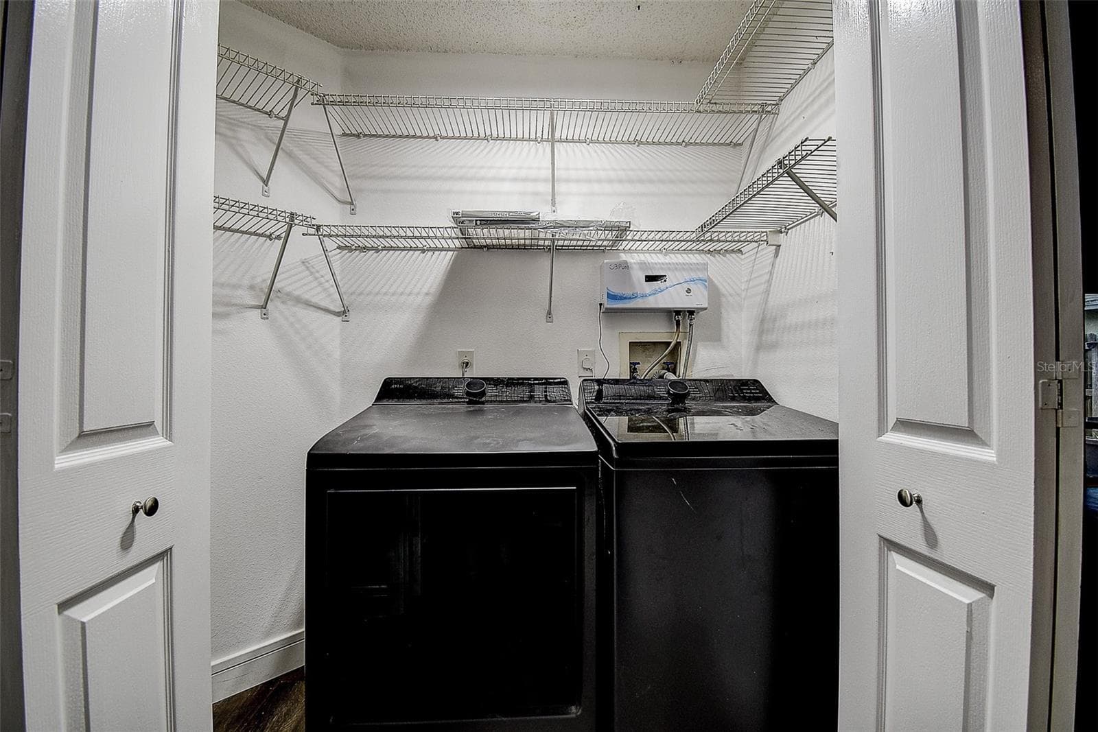 Laundry Closet in hallway near 2nd bath - 1709 SCOTCH PINE DR, BRANDON