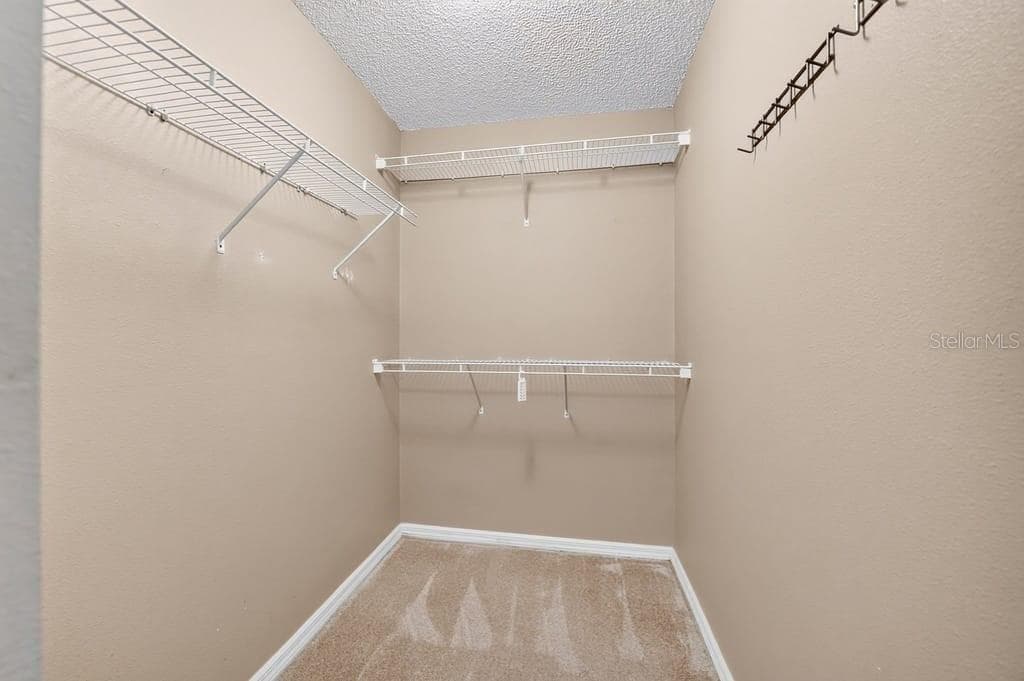 primary walk-in closet - 2316 WILLOW OAK DR, EDGEWATER