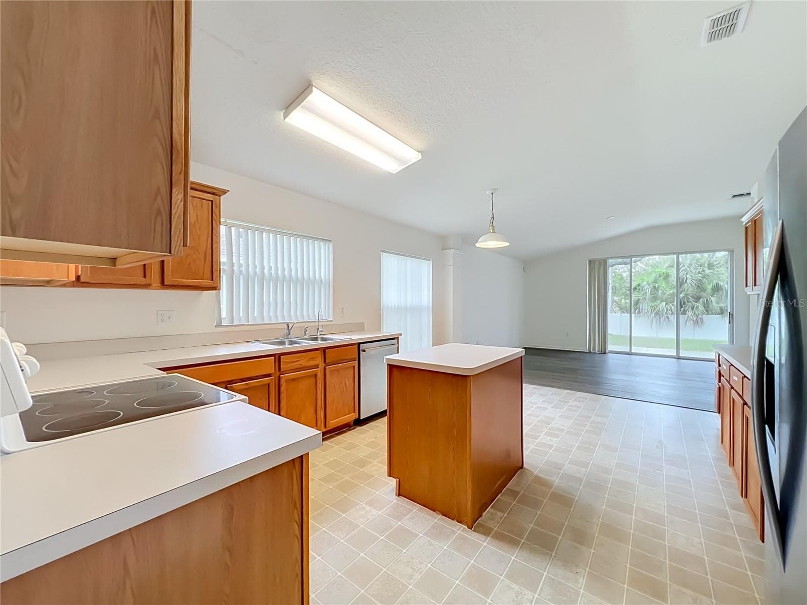 ...to the kitchen - 1199 SNUG HARBOR DR, CASSELBERRY
