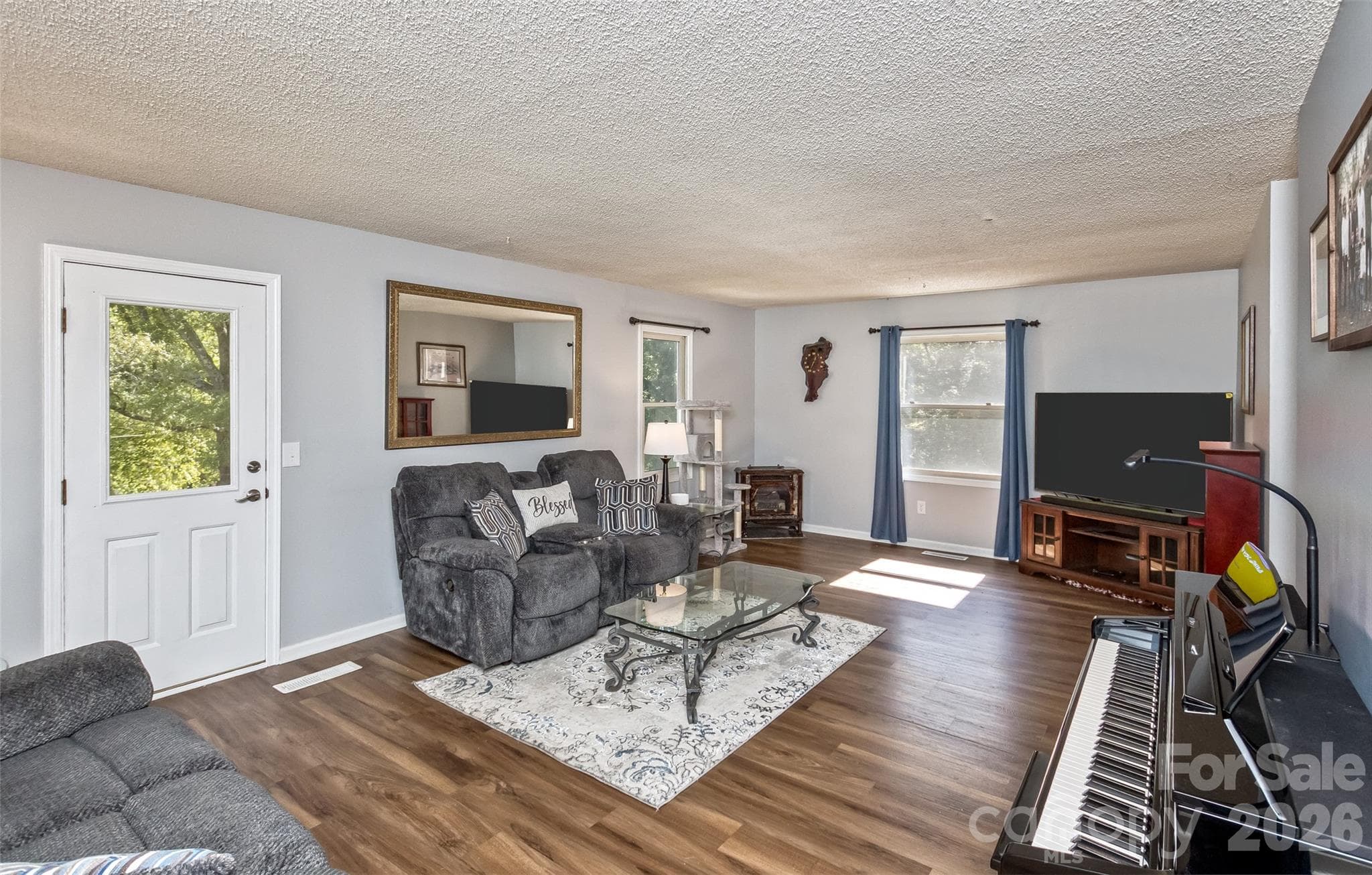 Living Room with outside door that steps out to the screened room - 2911 Middleton Place, Hendersonville