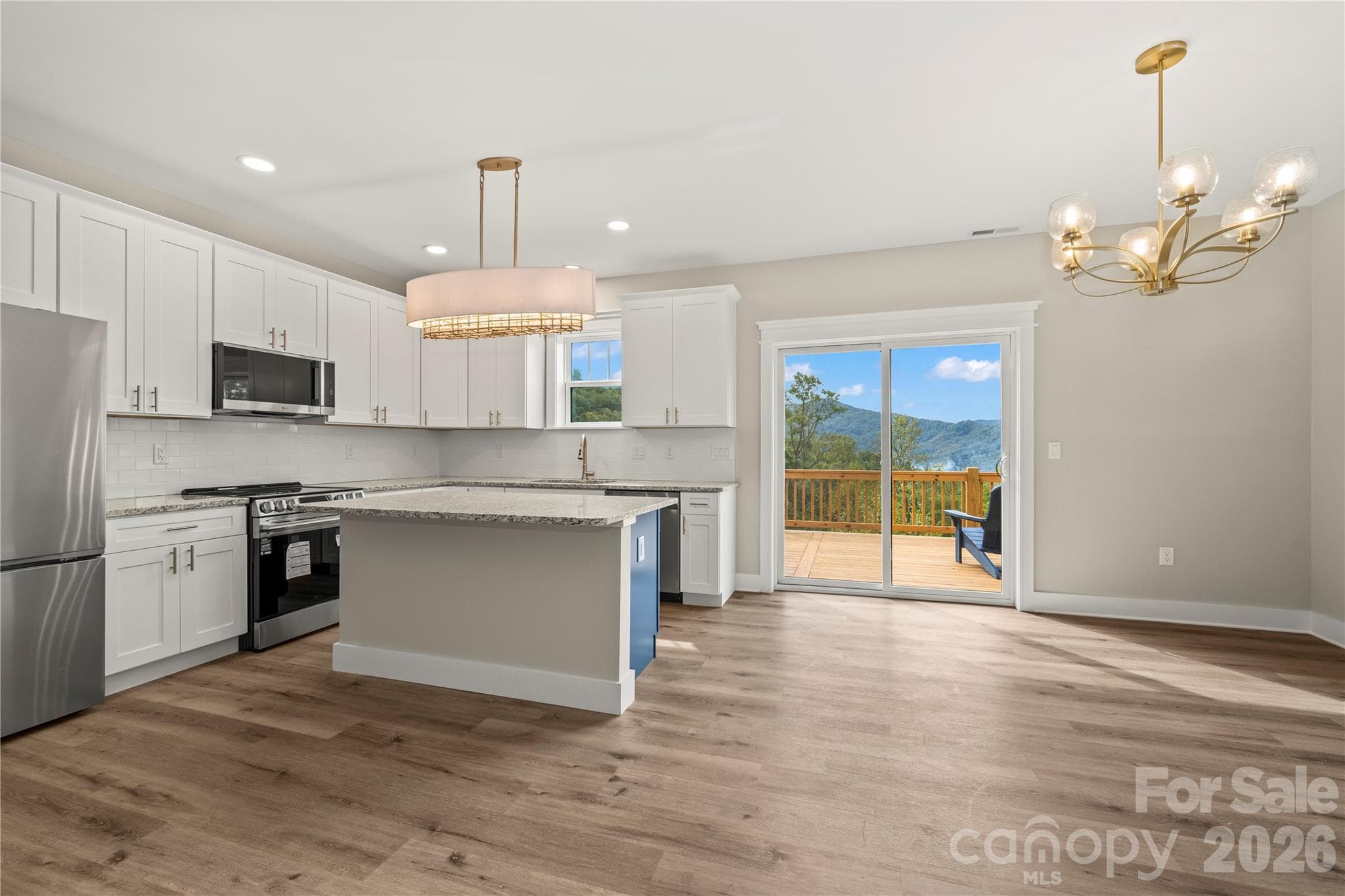 Open floor plan with island in kitchen - 9 Nellie Bell Lane, Swannanoa