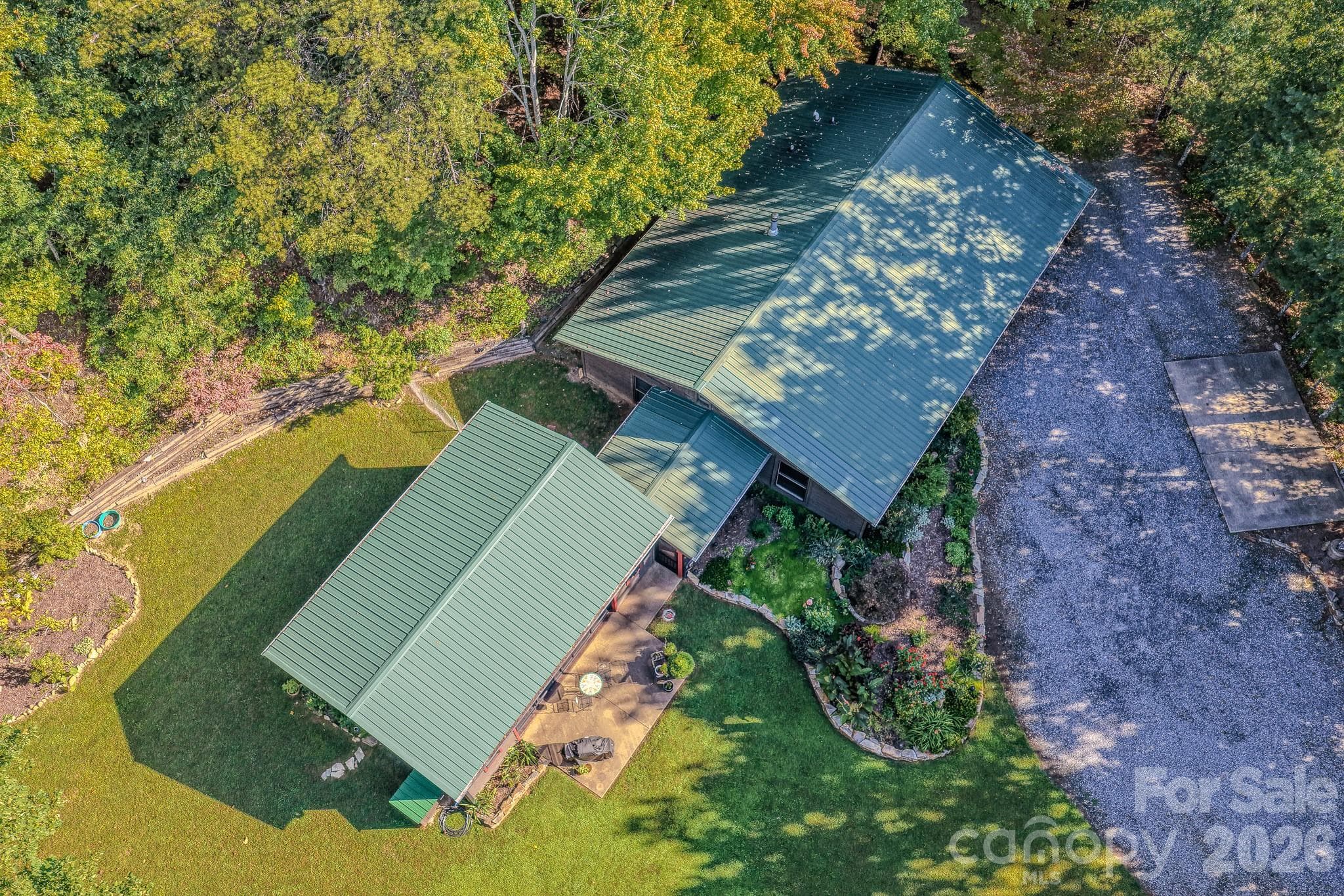 Metal roof, low-maintenance exterior, and easy single-level living in Old Fort, NC. - 54 Winning Way, Old Fort