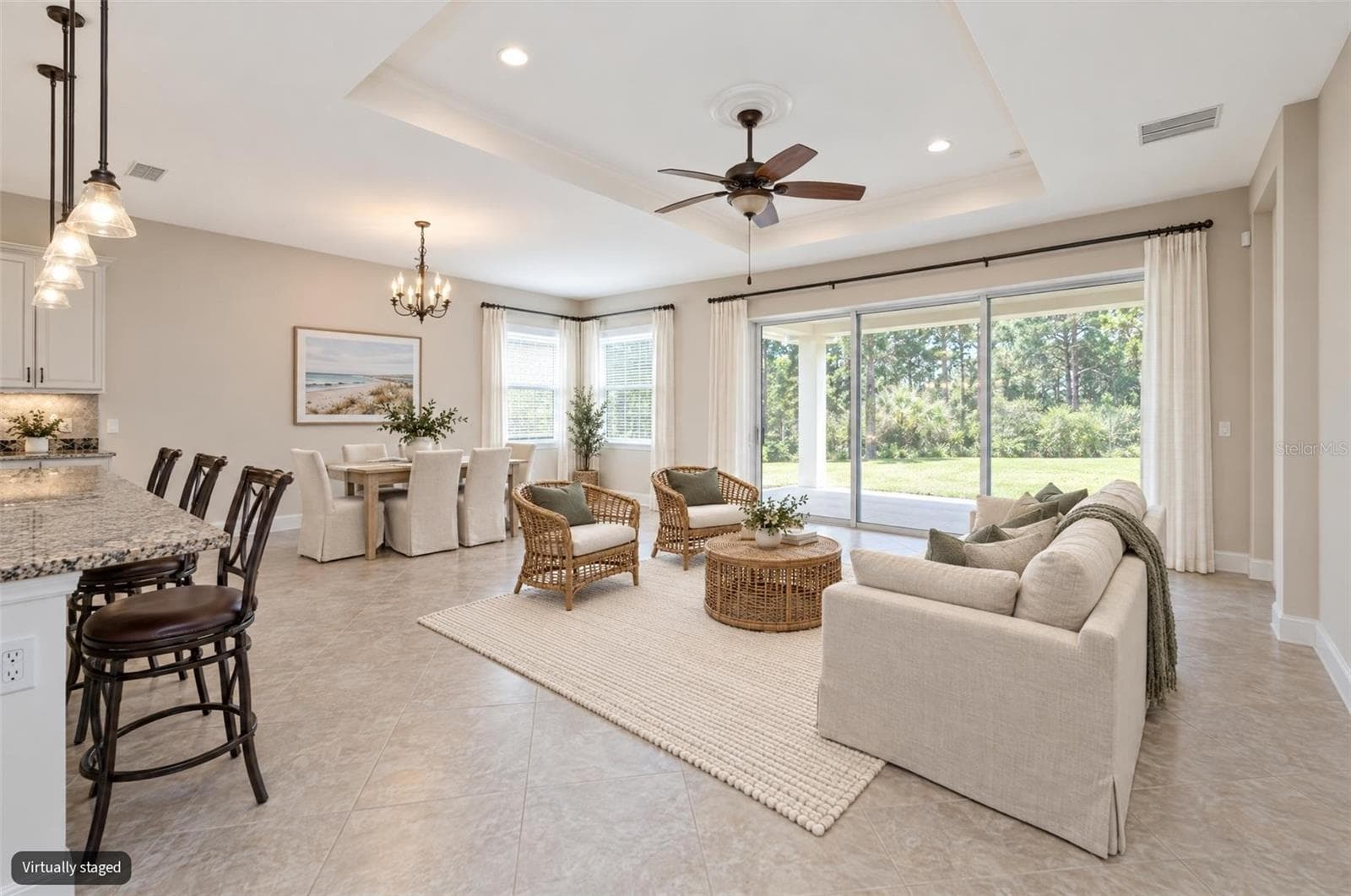 Great room / Dining Combo Virtual Staged - 1076 GARDENSHIRE LN, DELAND