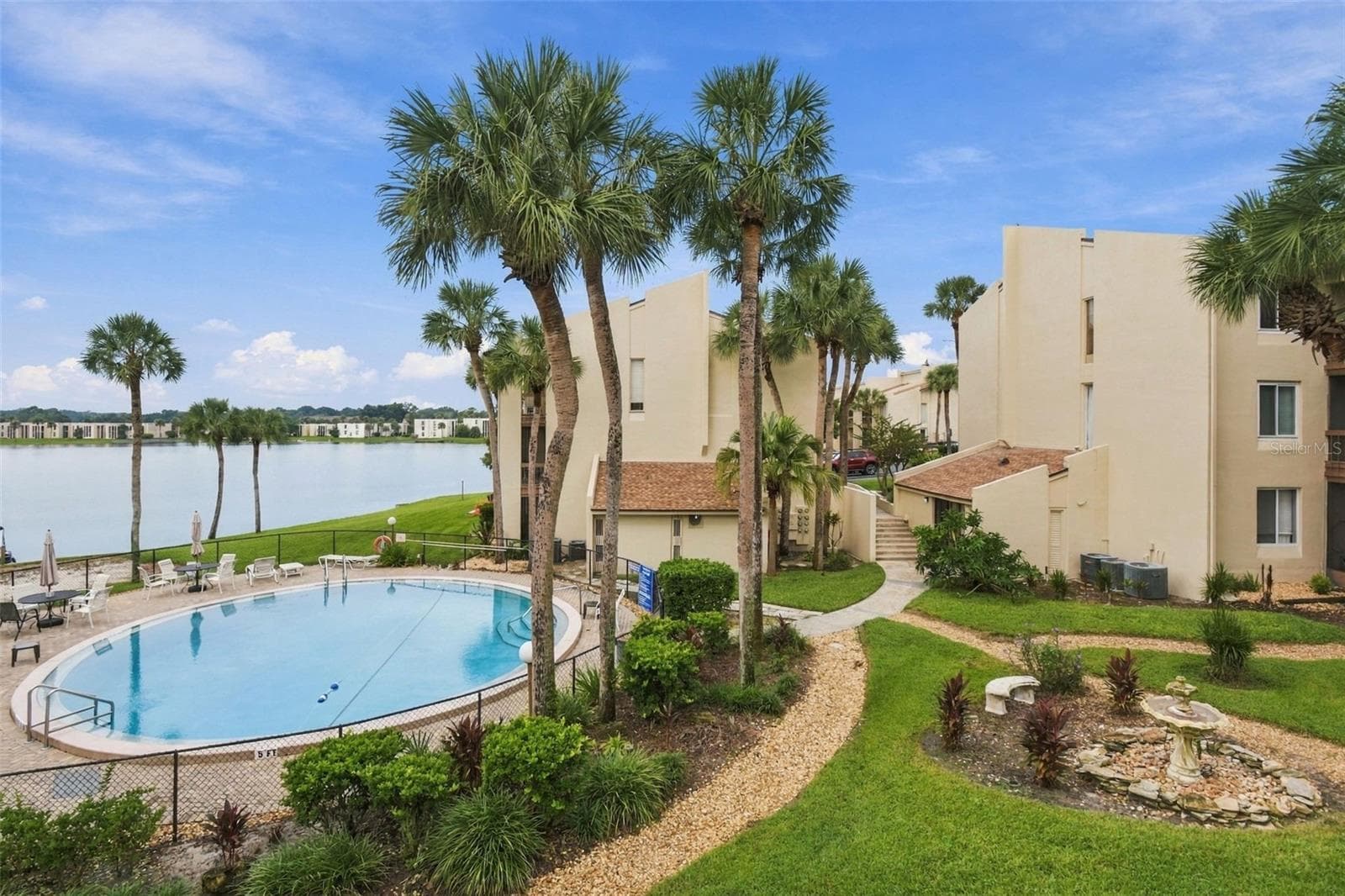 View off of the balcony of pool and LAKE - 610 ORANGE DR #188, ALTAMONTE SPRINGS