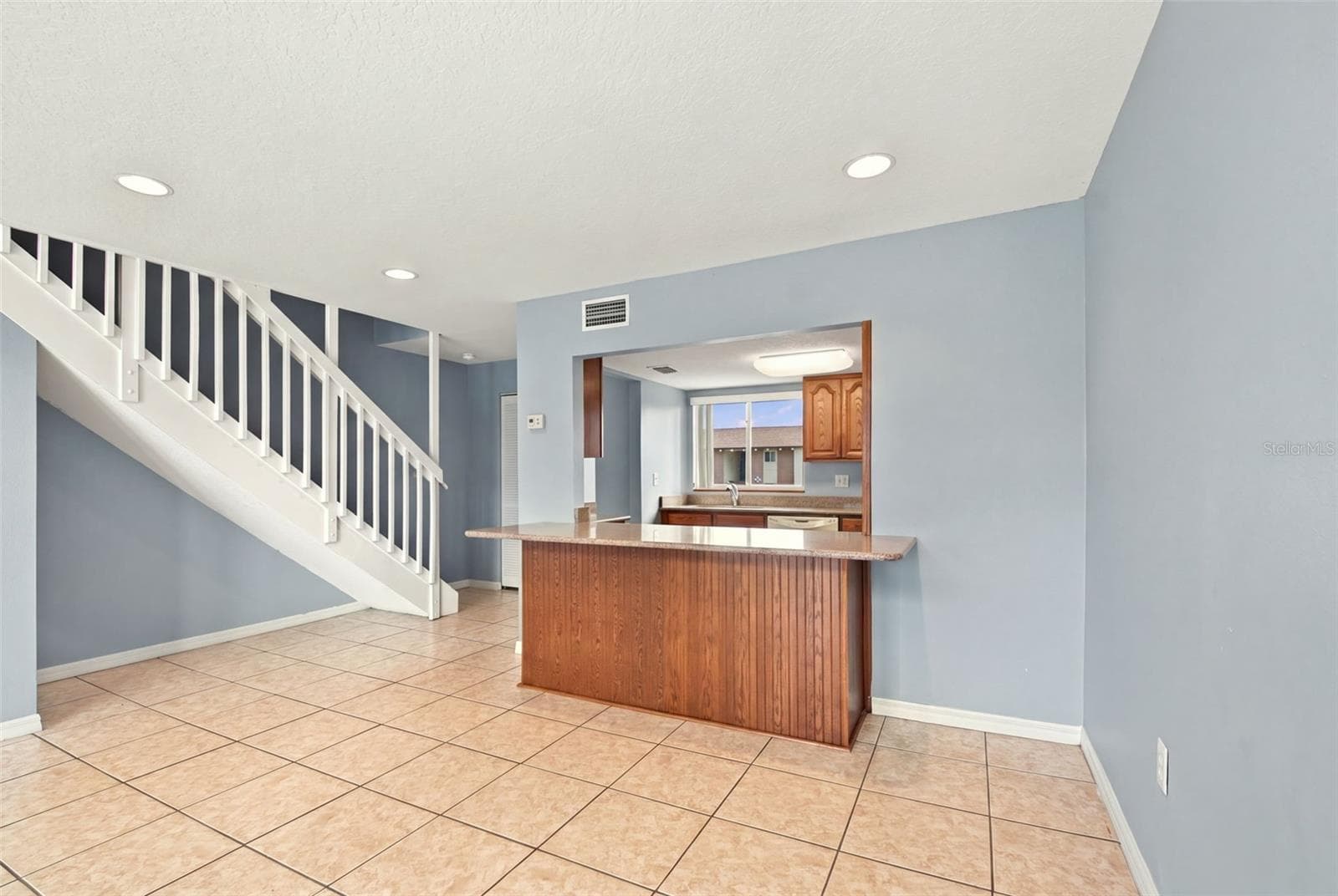 Dining room to kitchen with extra can lighting - 610 ORANGE DR #188, ALTAMONTE SPRINGS