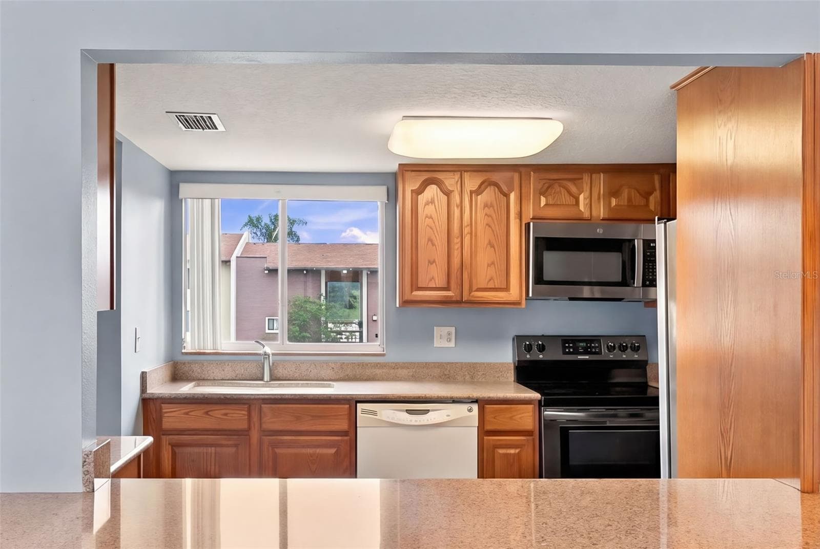 Looking into Kitchen with a window - 610 ORANGE DR #188, ALTAMONTE SPRINGS
