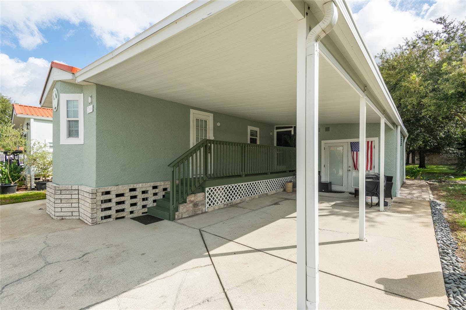 Stay completely dry when going from the carport or the storage room. - 6544 LA MESA RD, LAND O LAKES