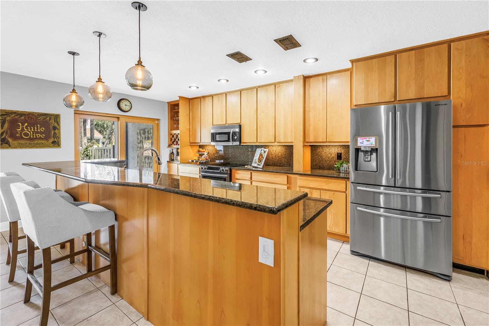 Updated Range and full 42-inch upper solid wood soft close cabinets and drawers - 990 SAN CARLOS CT NE, ST PETERSBURG