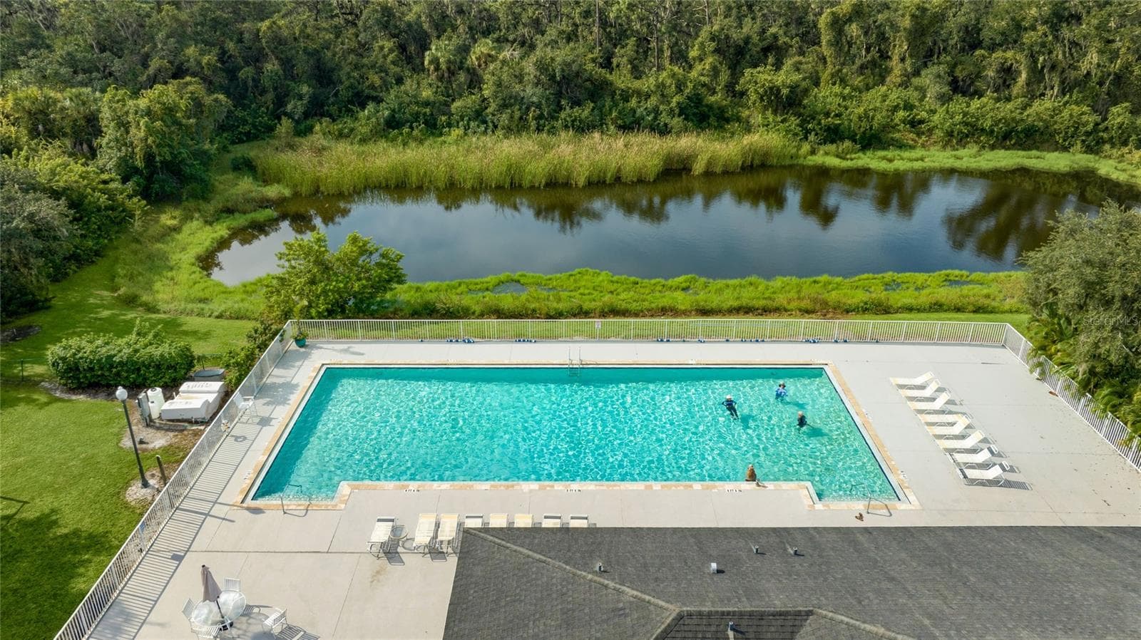 The club at River Wilderness features a Junior Olympic-size pool. - 3306 LITTLE COUNTRY RD, PARRISH