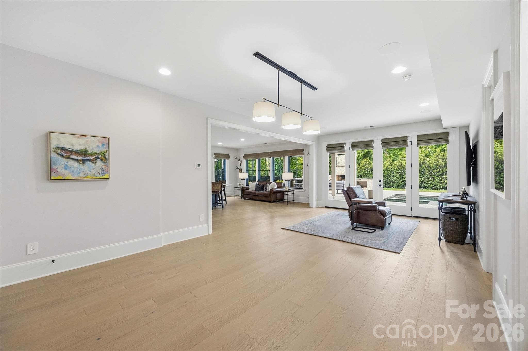 Recreation room open to living and mini-kitchen on lower level - 6222 Louis Patrick Lane, Charlotte