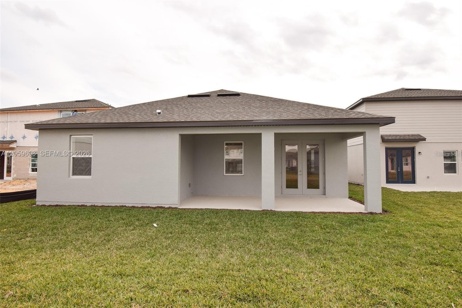 Rear Exterior with Covered Patio and Backyard - 2370 LANCASHIRE ST, DAVENPORT