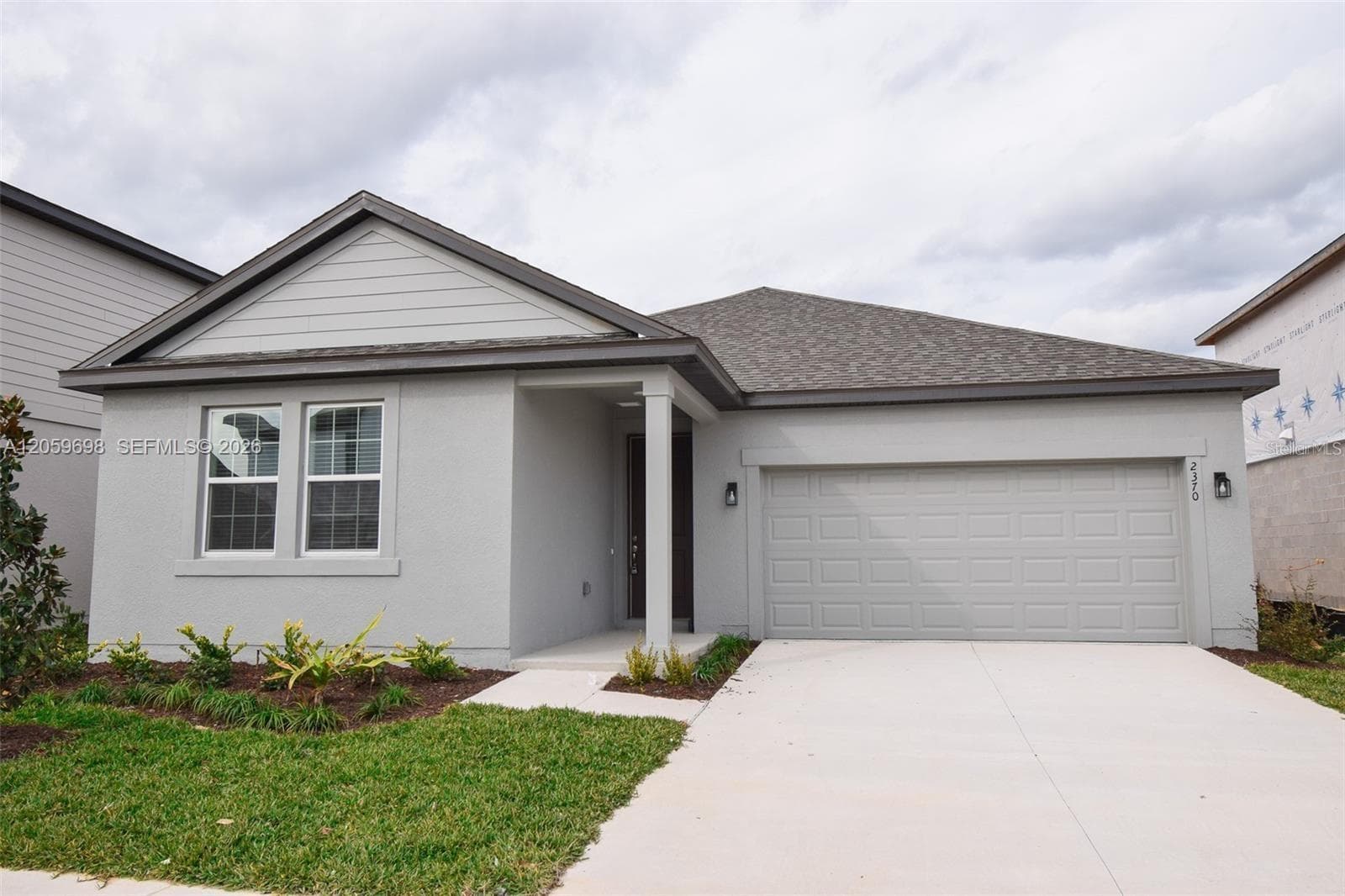 Front Exterior and Driveway - 2370 LANCASHIRE ST, DAVENPORT