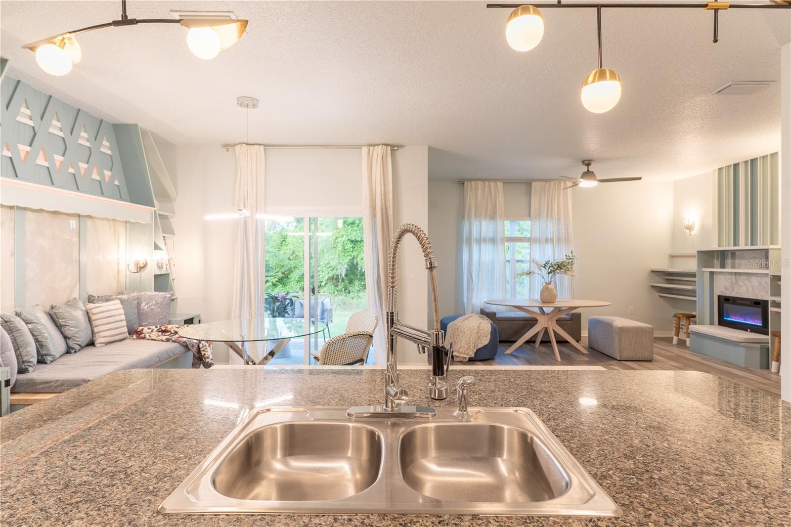 View of breakfast nook and living room from kitchen - 5949 SW 83RD TER, GAINESVILLE