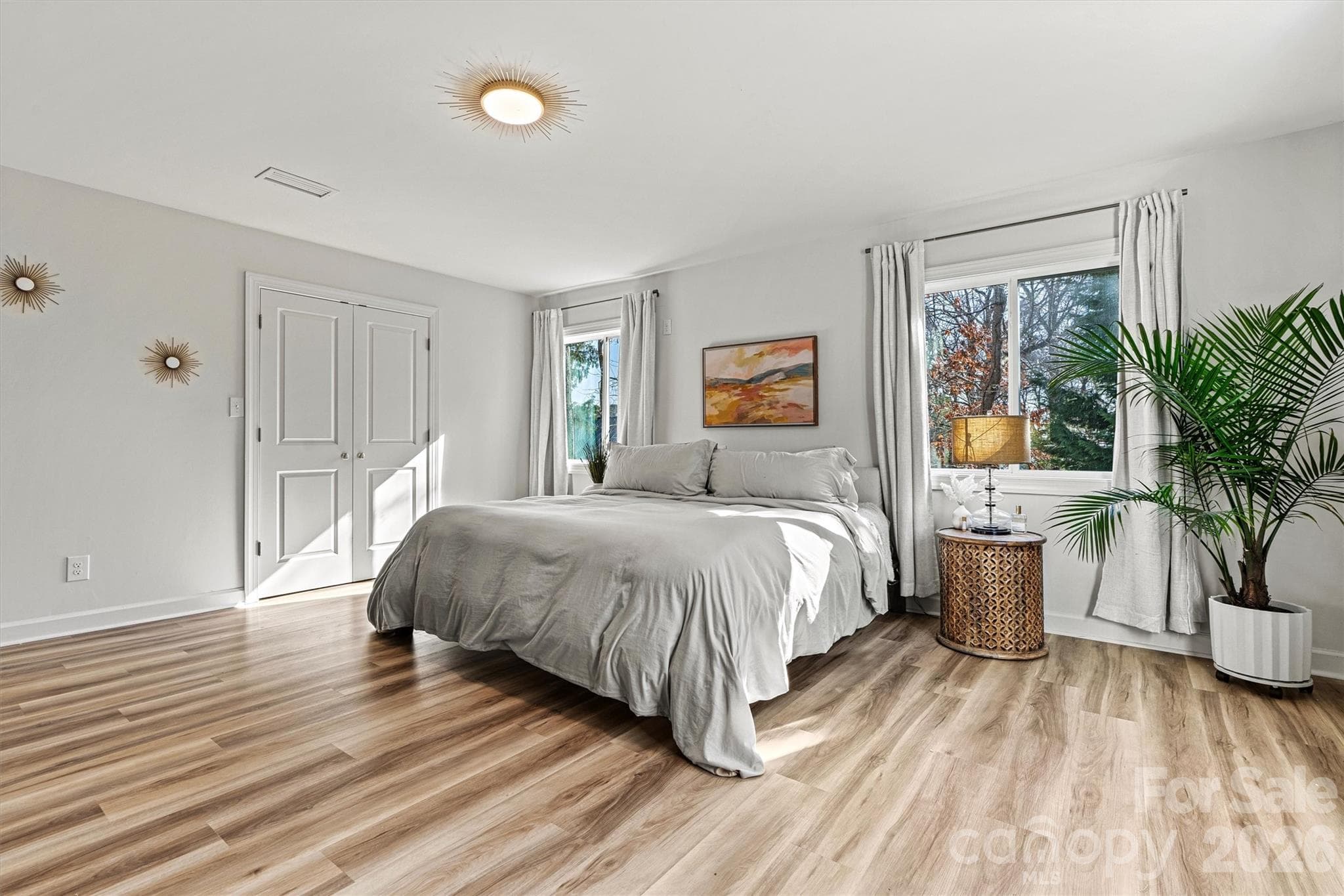 Primary bedroom has lots of natural light. Plenty of room for multiple beds if you were to use this property as a rental - 3995 Burton Lane, Denver
