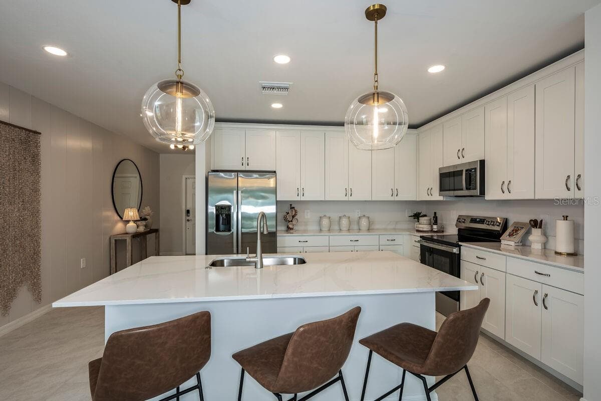 Kitchen-Photo description represents the model home of same floor plan. - 24500 SW KINGSWAY CIR, LAKE SUZY